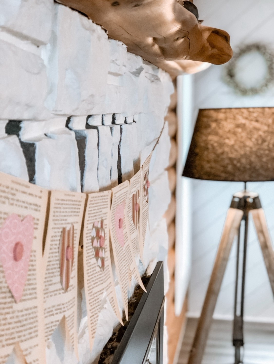 DIY Valentine Decor. I took the pages of an old book and cut them in a bunting shape, then cut out hearts from different pink patterned paper and glue a pink button on top of each. Then I folded the edge of the book page over string and glued it in place.  Looks lovely strung across a fireplace  

#LTKholiday #LTKstyletip #LTKwinter