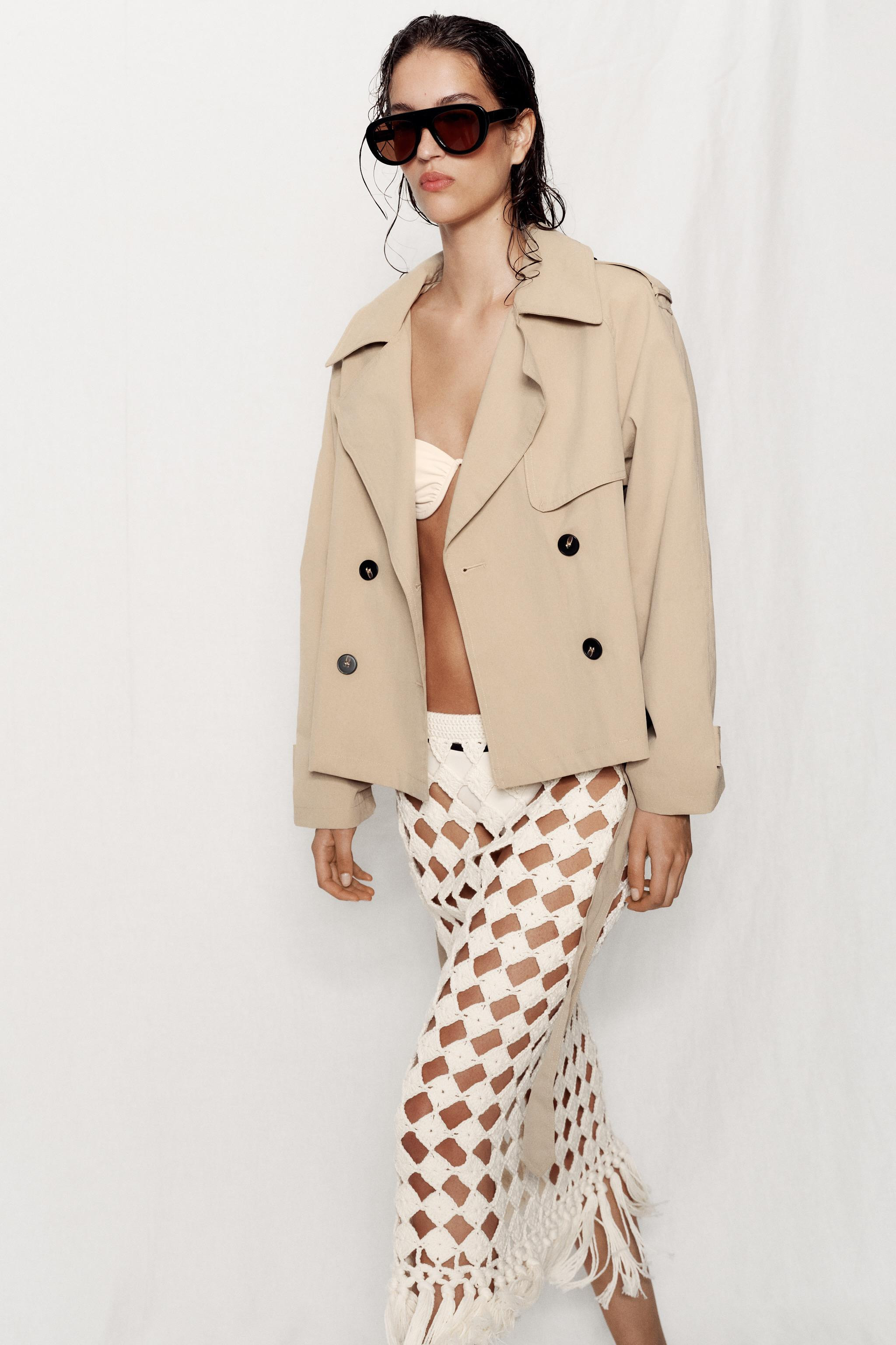 Model height: 183 cmShort trench-style jacket featuring a regular collar and long sleeves with sh... | Zara US