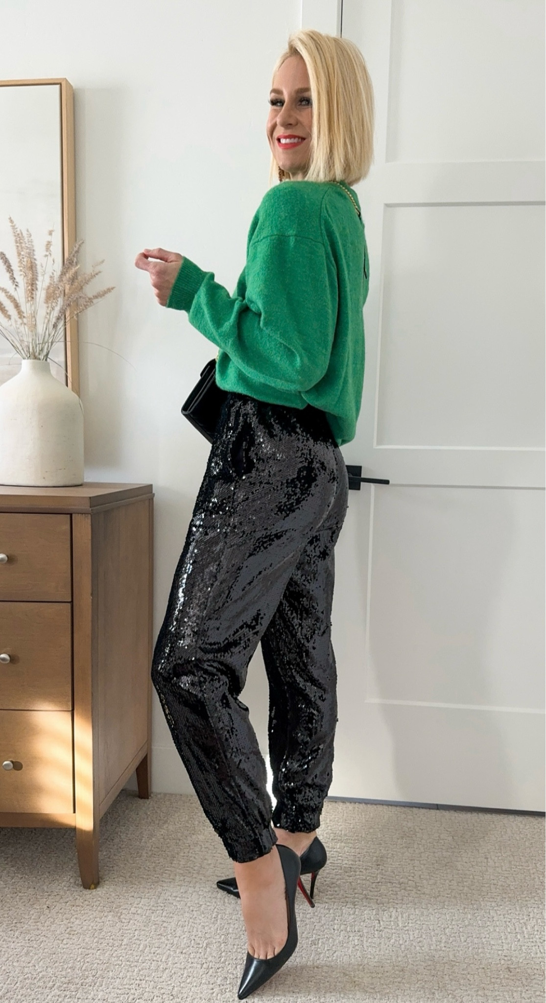 Sale sequin joggers! Hurry and grab your size before they’re gone. They come in a metallic silver as well. Use code: HOLIDAY 
Oversized green sweater perfect for the holidays! On sale toady, 11/21 for $20 bucks 
Sizing 
Wearing size small and pants and small sweater.

#LTKsalealert #LTKHoliday #LTKCyberWeek