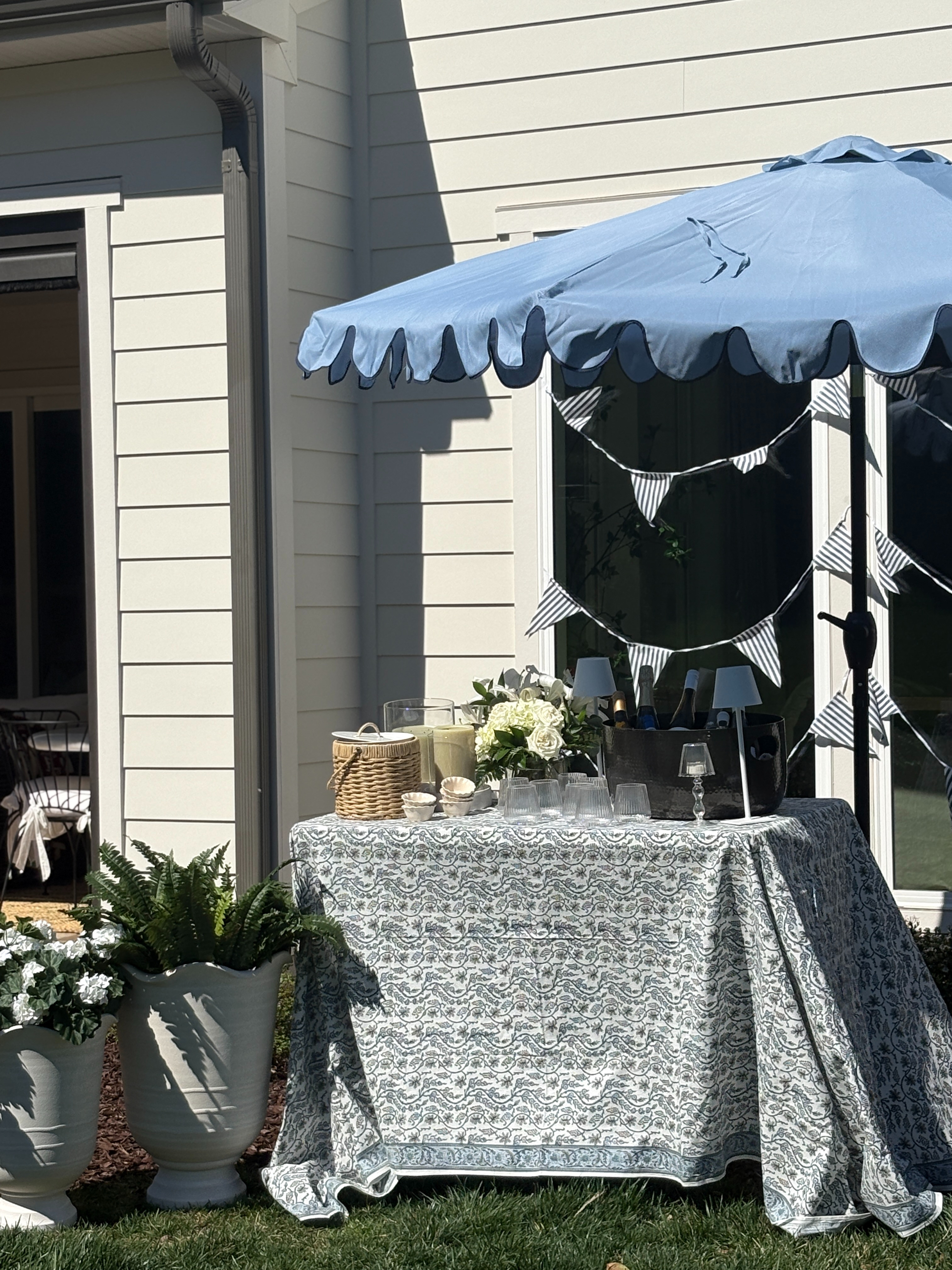 Creating a simple backyard drink station makes hosting so much easier. I layered a patterned tablecloth, added a few glassware pieces, fresh florals, and this scalloped umbrella to keep everything shaded and elevated. Such an easy setup for backyard birthdays, summer parties, or casual get-togethers. Everything I used is linked here. 🍸🌿 

 

#LTKSeasonal #LTKHome