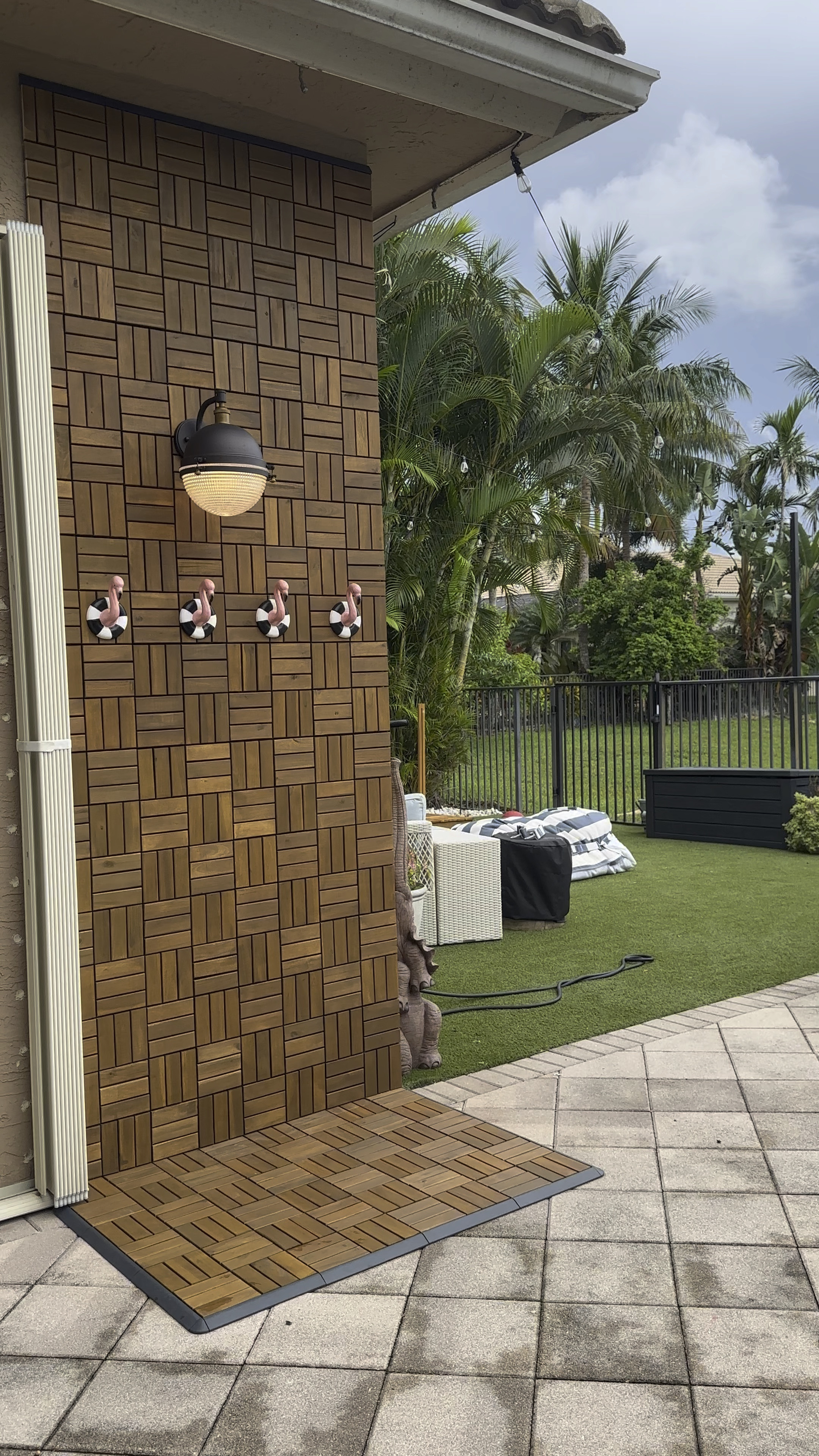 Towel hook • outdoor accent wall • backyard decor • pool accessories • South Florida home • outdoor living spaces • outdoor decor • 

Wooden accent tiles are the RUNNEN
Decking tiles from IKEA in color acacia. 

#LTKHome #LTKSeasonal