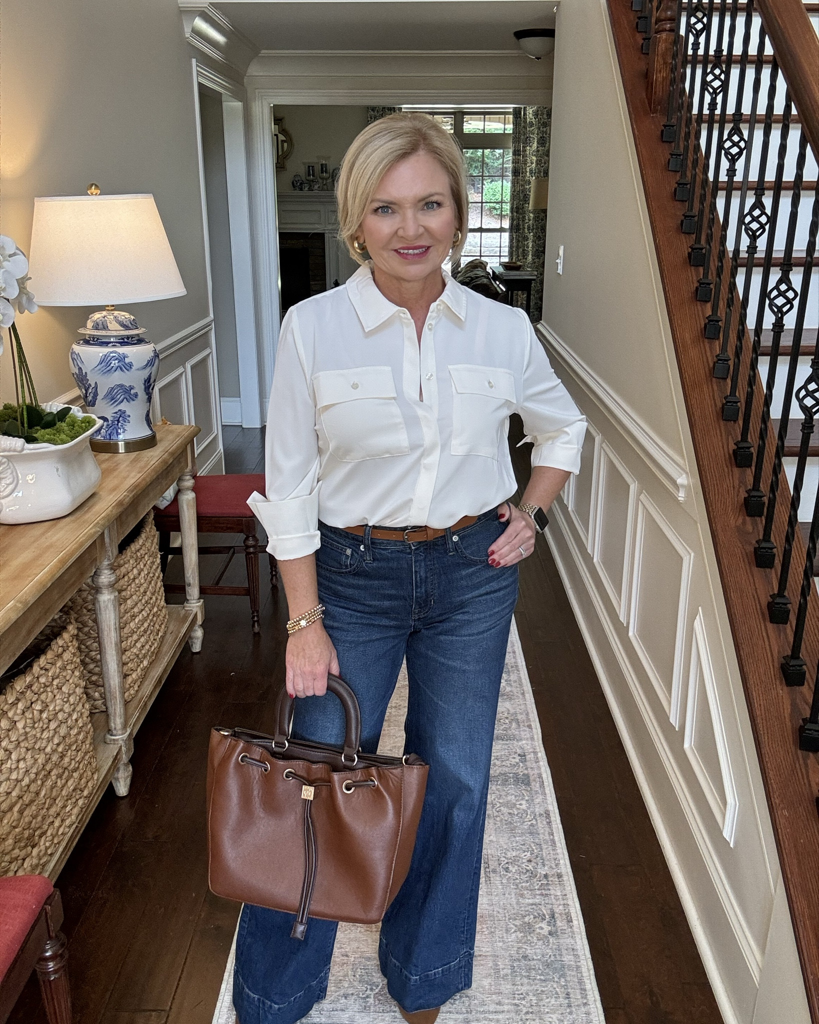 Wide leg jeans CAN make your legs appear to be a mile long if you choose a style that isn't too wide and wear them with a heel.  These from J Crew run large, so size down. I'm wearing them in a 26 regular length to be long enough for heeled booties. I'm wearing the blouse in Small. 

Wide leg denim
Jeans
Fall outfit
Boots
Casual outfit
Business casual
Over 50
Petite

#LTKStyleTip #LTKOver40 #LTKSeasonal