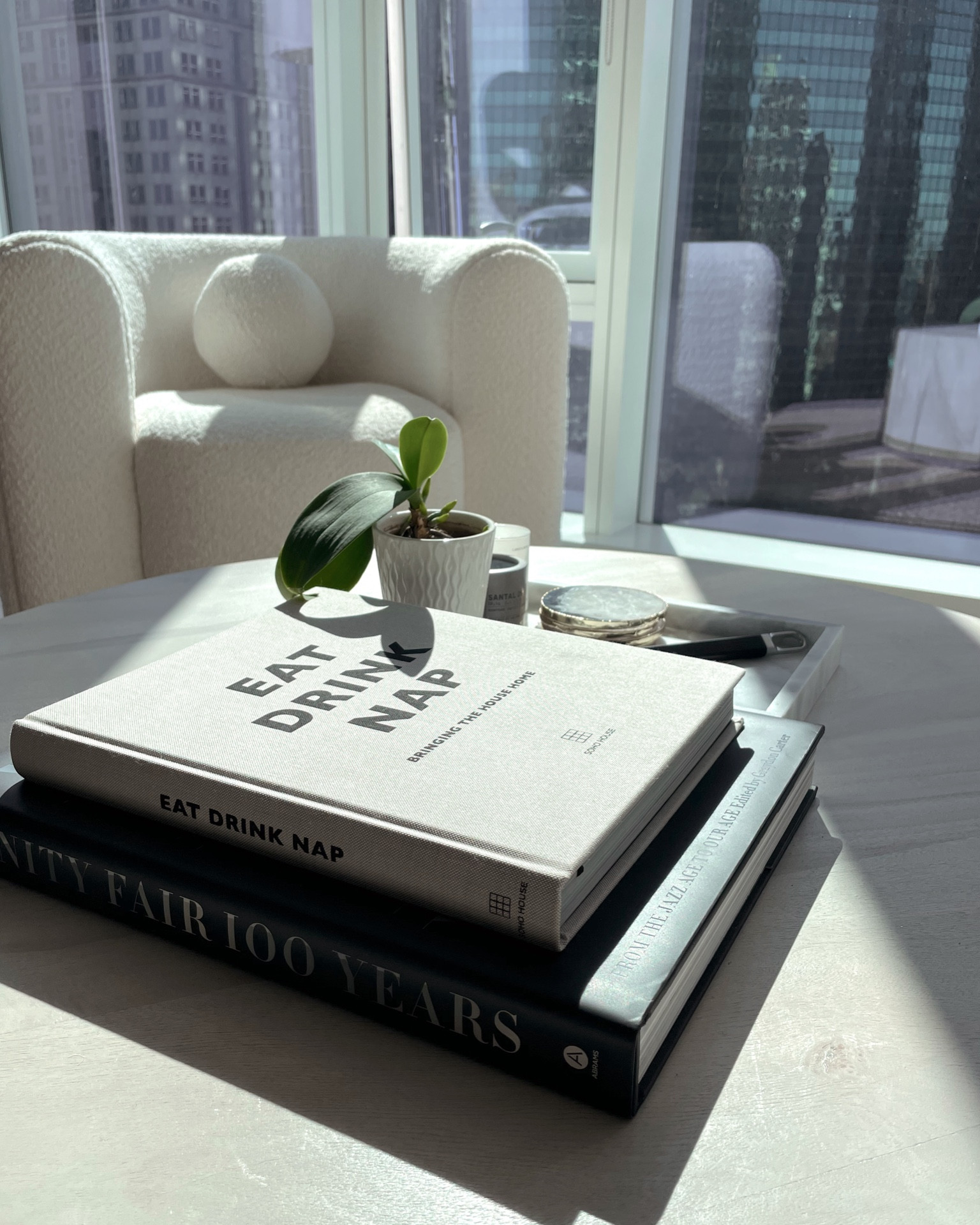 Living room inspo. White couch. Modern aesthetic. Soho house decor. Coffee table books. Home decor #Whitecouch #coffeetable #decorativebooks #marbledish #boucle 

#LTKhome #LTKstyletip #LTKxPrime