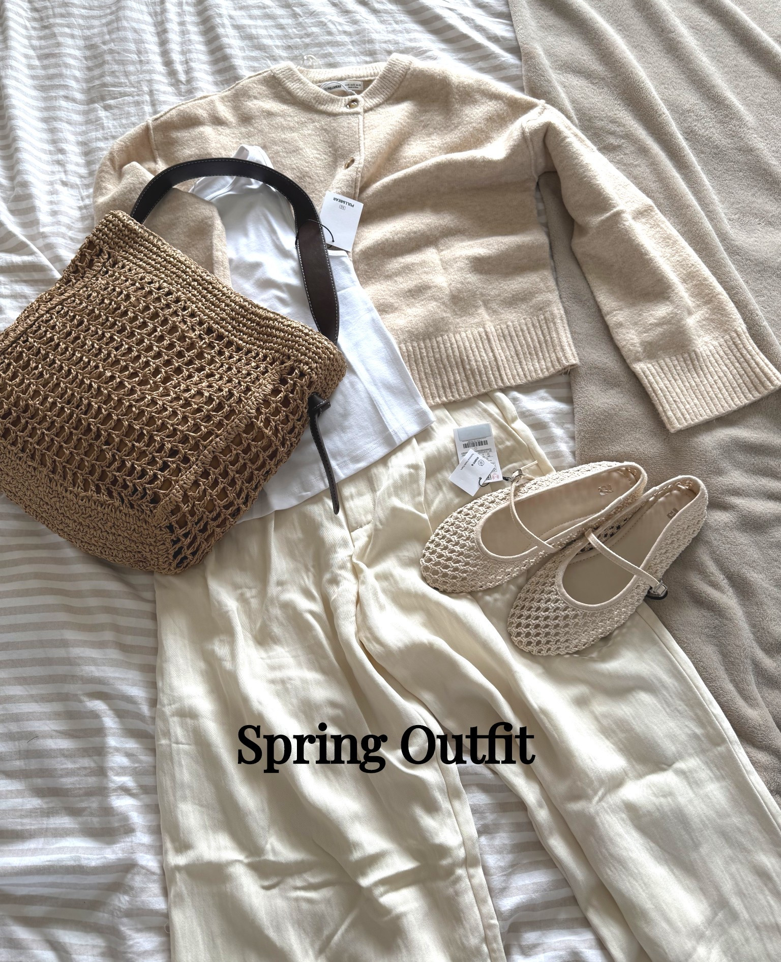 All neutral spring outfit with woven tote bag,  crochet shoes, cream cardigan and darted smart trousers 🤍 

#pullandbearcommunity 

#LTKuk #LTKspring