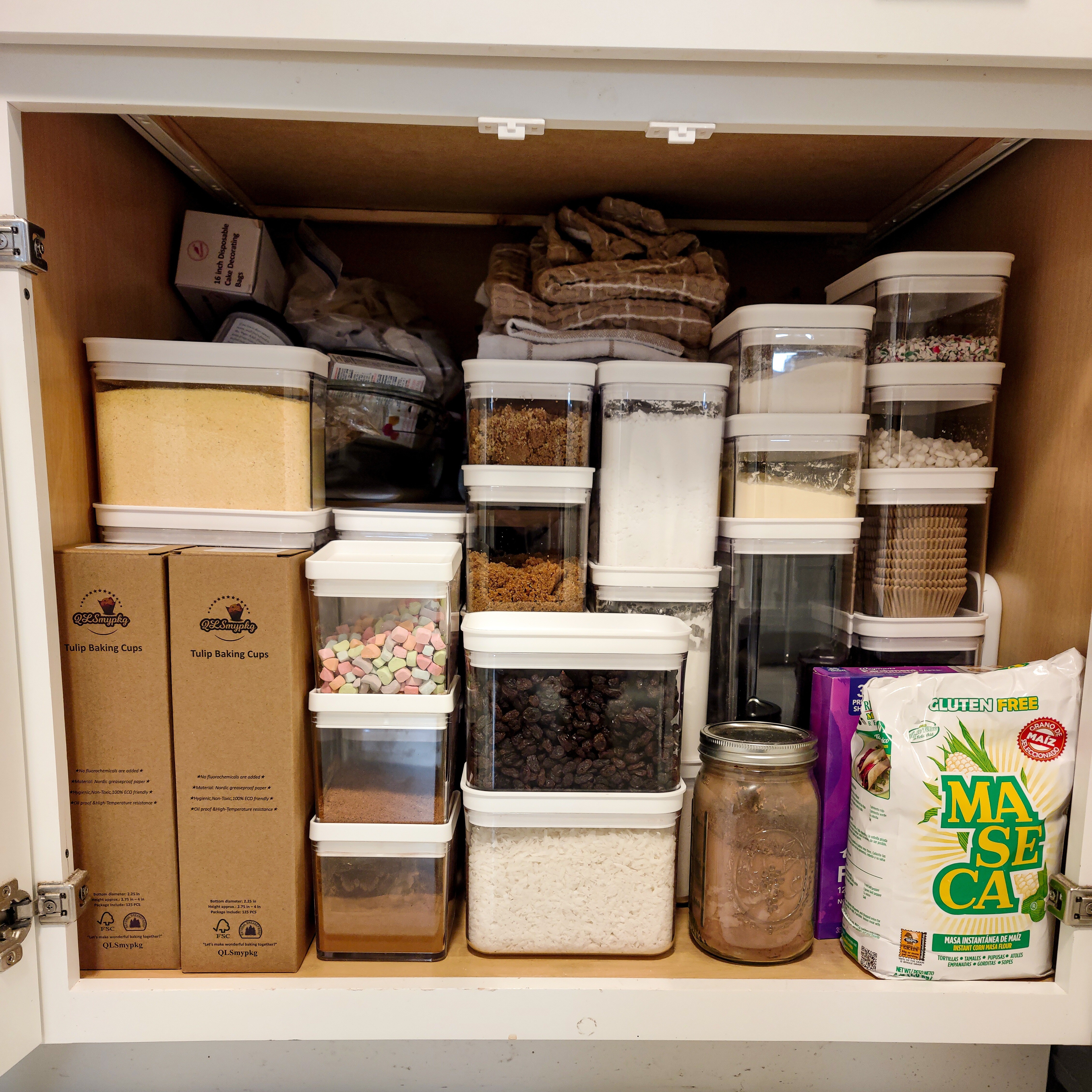 My baking cabinet canisters and organization.  Buying in bulk  means a good collection of pantry containers is a must.  

#LTKfindsunder100 #LTKhome