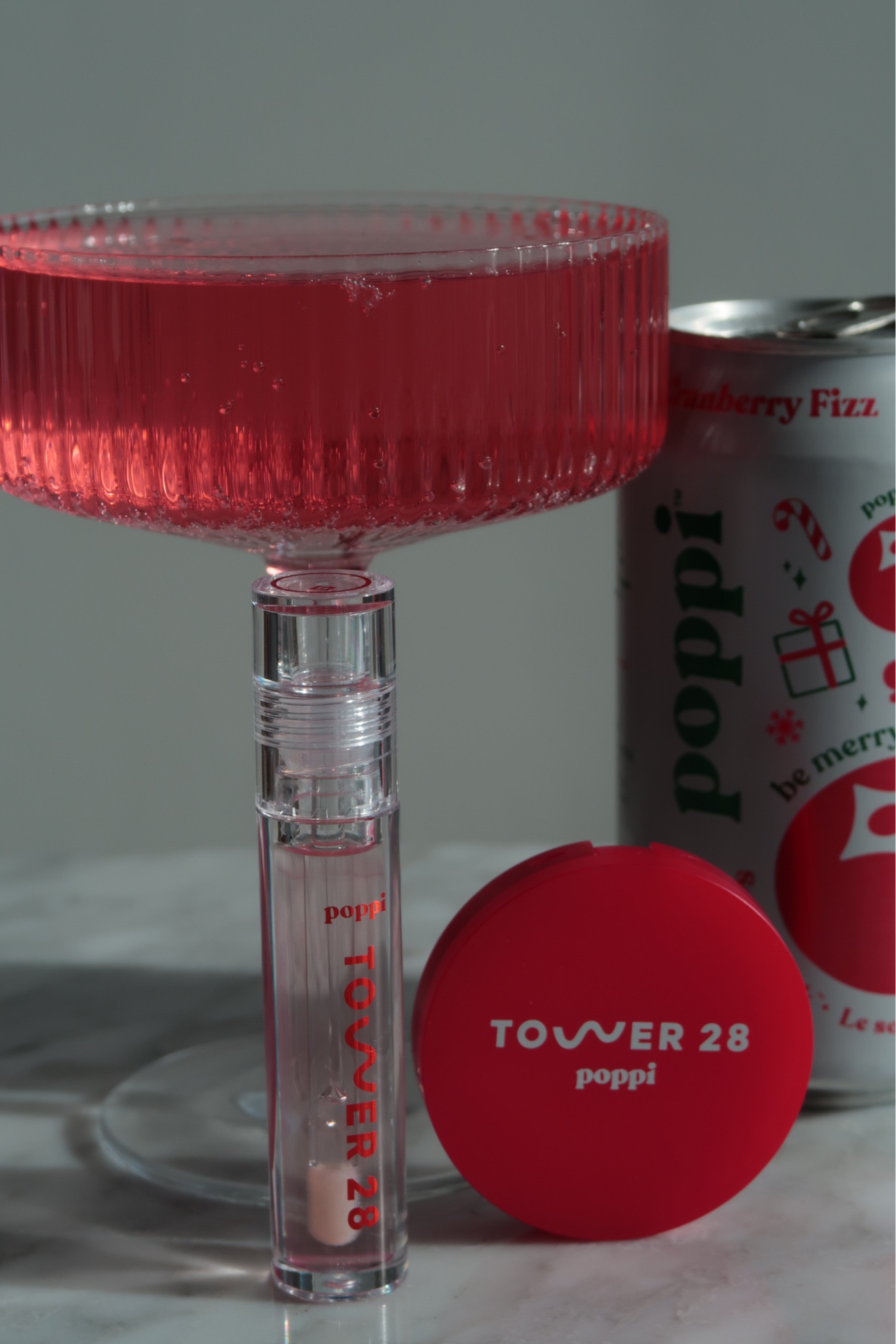 The Tower 28 × Poppi collab feels like a little burst of brightness in your beauty routine — airy, juicy, and instantly mood-lifting. The clear, soda-inspired packaging catches the light in the prettiest way, giving the whole collection a fresh, dewy glow before you even open it. Inside, the formula is classic Tower 28: lightweight, hydrating, and designed to melt into the lips with a sheer tint that looks naturally flushed.

Cranberry Fizz gives that perfect pop — soft, fruity colour with a glossy finish that makes lips look healthy and smooth without ever feeling sticky. It’s the kind of product you reach for when you want something effortless: a low-maintenance gloss that still makes you look awake and polished. Think clean-girl beauty, but fun… a glowy moment with just a hint of fizz.

A collab that brings together the best of both brands: Tower 28’s sensitive-skin-friendly simplicity and Poppi’s upbeat, playful energy. Easy, bright, and genuinely joyful to use.

Hashtags
#Tower28Beauty #PoppiCollab #FizzFrost #CranberryFizz #CleanBeauty #JuicyLipLook #MinimalMakeup #GlowyBeauty #BeautyTok #SoftGlow #GlossyLipLook #AestheticBeauty

#LTKHoliday #LTKGiftGuide