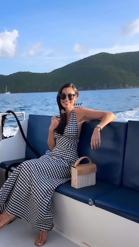 Kat Jamieson wears a gingham dress in the BVIs with a wicker bag. Yacht, boat, summer outfit, classic style, summer dress. 

#LTKSeasonal #LTKTravel #LTKItBag