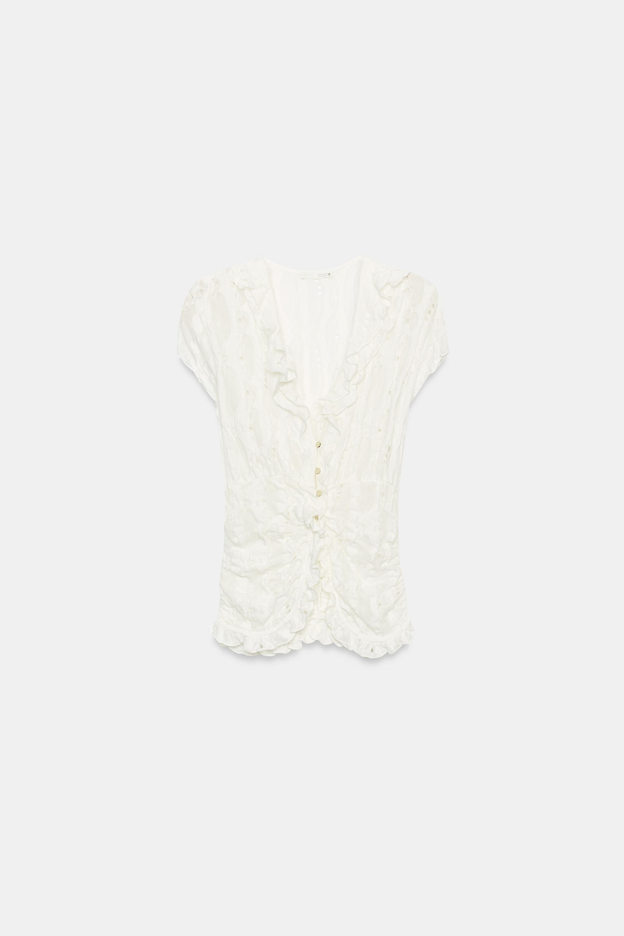 Model height: 178 cmV-neck blouse with short sleeves. Featuring fabric with cutout details, gathe... | Zara UK
