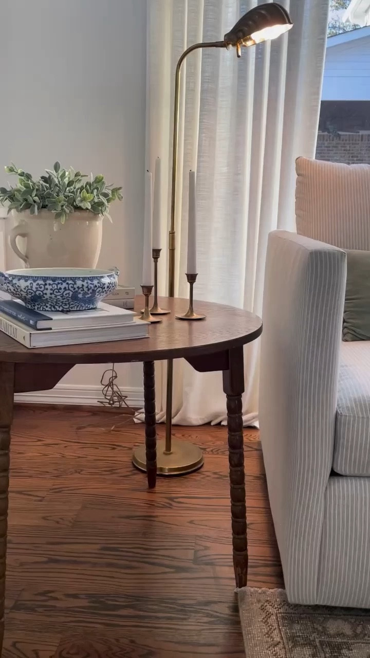 Family room sitting area 
Swivel chairs
Vintage decor
Coffee table books 
Blue & white
Moss balls

#LTKhome