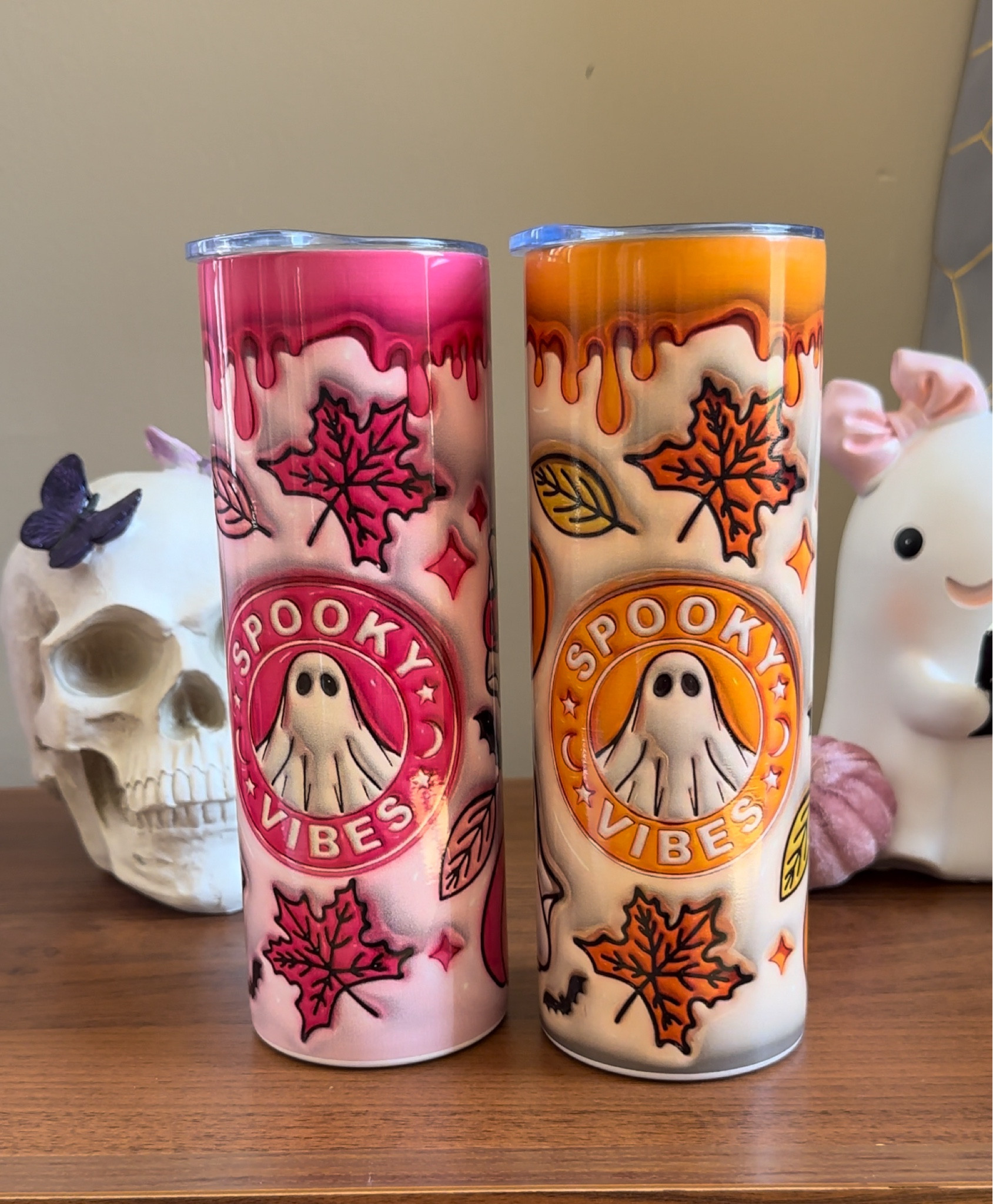 
Welcome to our Halloween tumbler showdown!

On the left, we have the vibrant pink tumbler, dripping with a playful pink glaze. It's adorned with cute autumn leaves and an adorable ghost that gives off those fun "Spooky Vibes."

On the right, meet its warm-toned counterpart. This tumbler features a rich orange glaze, echoing the cozy hues of fall. The friendly ghost and colorful leaves make it perfect for sipping your favorite pumpkin-spiced drinks.

Both tumblers share a delightful theme but offer unique color palettes to suit your Halloween mood. Whether you're feeling pretty in pink or opting for traditional orange, these tumblers are sure to add a festive touch to your spooky season!

Which one matches your Halloween spirit? Let me know in the comments below!
#halloween2024 #fall2024

#LTKHome #LTKFamily #LTKSeasonal