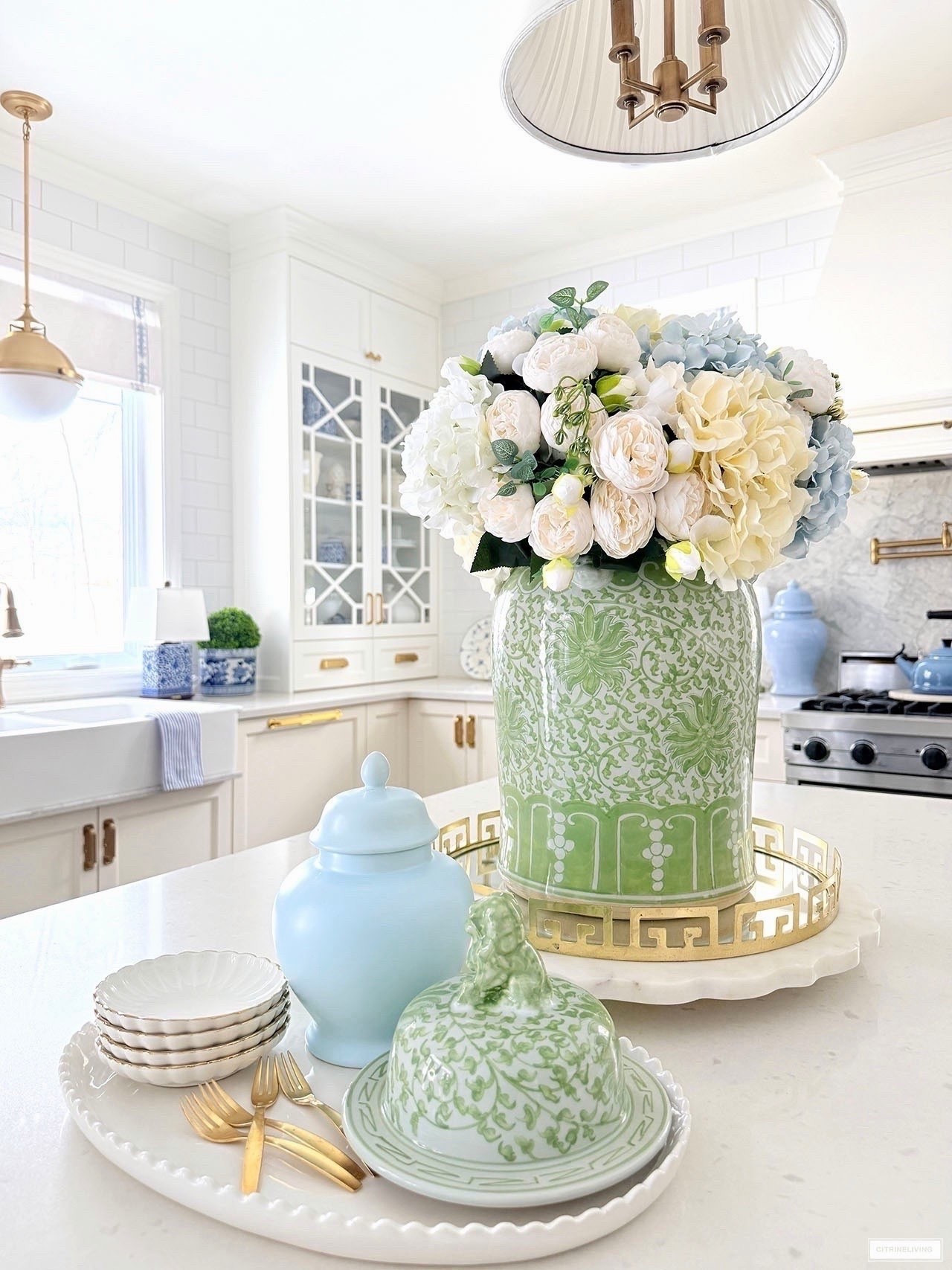 Chic spring kitchen details! Layer trays and accessories with an oversized floral arrangement in a gorgeous ginger jar for a stunning look!

#LTKSeasonal #LTKHome