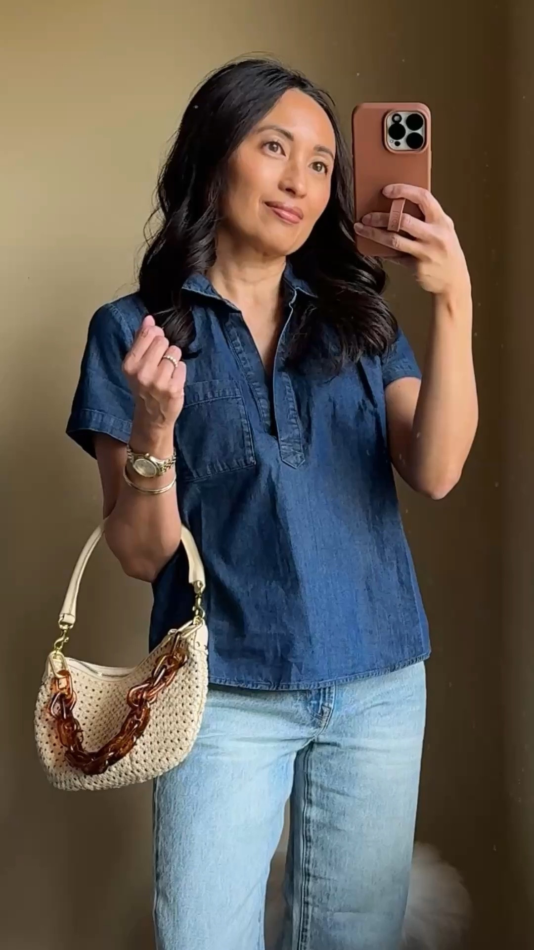 Spring outfit. Denim chambray shirt. Denim shirt. 
Cute popover style lightweight denim shirt. True to size; relaxed fit. 
Darker denim top looks good with light denim jeans and light colored pants. 
Jeans: bower straight leg; size down if in between. 
Woven bag. Convertible bag. Crossbody bag. 
Jelly shoes.  Jelly sandals  

#LTKootd #LTKOver40