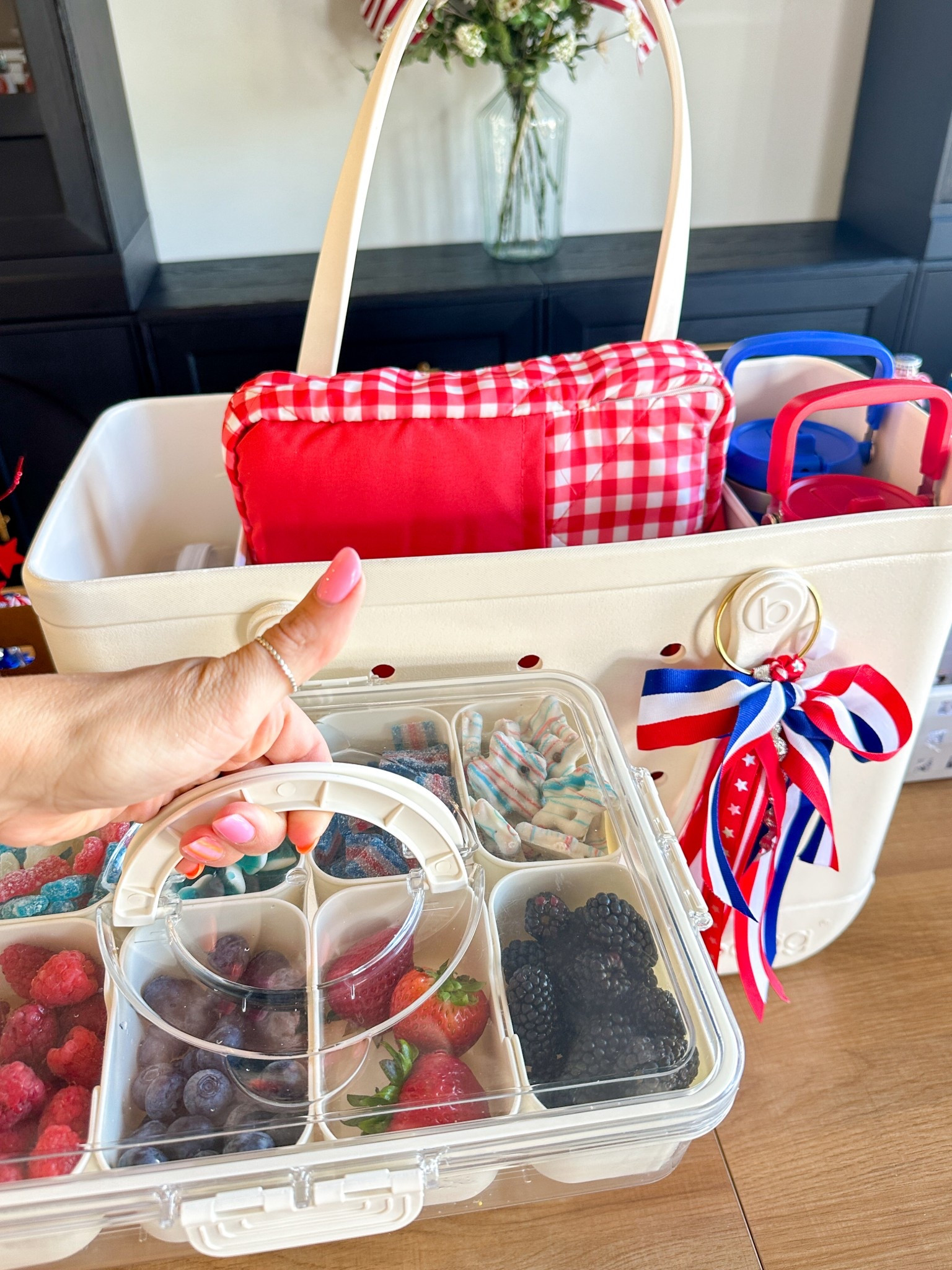 Bringing the ultimate snackle box to our 4th of July parade this year, and it’s a total win! Packed with red, white, and blue snacks, this festive snack organizer keeps everyone fueled up and happy while we wait for the fun to begin.
Inside the snackle box:
	•	Fresh berries like strawberries, blueberries, blackberries, and raspberries
	•	Popcorn, pretzels, crackers, red licorice, and mini marshmallows
	•	Red, white, and blue candies
	•	Cheese cubes and snack mixes
It’s portable, reusable, and perfect for parade day! The easiest way to serve up a variety of treats that kids and adults will love.

4th of July snackle box, parade day snacks, portable snack box, patriotic treats, festive snack ideas, red white and blue snacks, family celebration snacks, Independence Day ideas, easy snacks for kids, holiday treats

#LTKSummerEdit #LTKSeasonal #LTKFamily