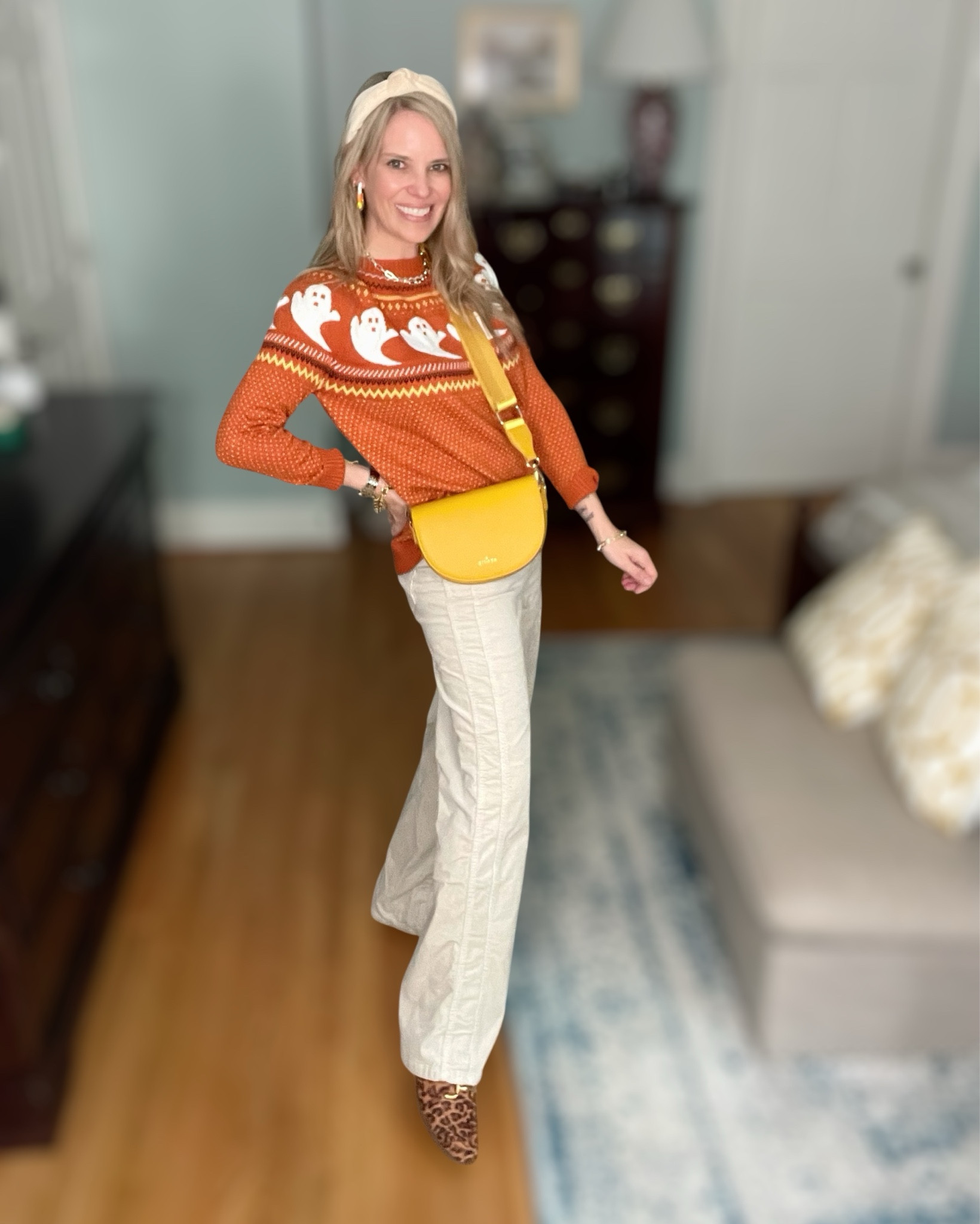 👻 Festive & cozy for fall! I styled this orange ghost sweater with wide-leg cream pants and leopard print mules for a playful yet chic take on Halloween style. I added my favorite yellow crossbody bag, candy corn earrings, and a neutral headband for a fun pop of seasonal flair. 🍂✨

This is such an easy outfit for October outings, pumpkin patches, or a casual Halloween get-together. The mix of cozy knits, statement accessories, and a touch of leopard makes it feel elevated while still festive. 🧡

ghost sweater Amazon, Halloween outfit inspo, cozy fall sweater, festive fall outfit, casual October style, pumpkin patch outfit idea, leopard print mules, Amazon Halloween sweater, chic spooky season outfit, fall fashion 2025


#LTKFindsUnder50 #LTKItBag #LTKShoeCrush

#LTKFindsUnder50 #LTKOver40 #LTKSeasonal