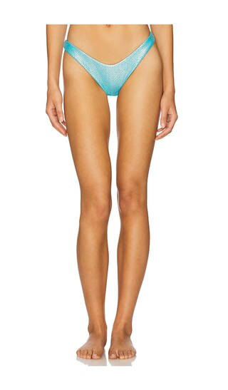 Luminous High Leg Brazilian Bikini Bottom in Metallic Blue | Revolve Clothing (Global)