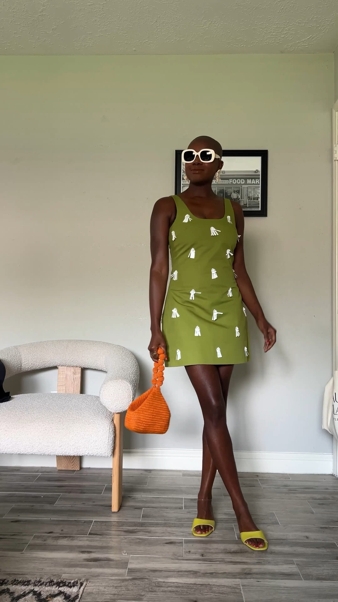 Green mini dress with white sand dollar appliqué details, orange raffia wrist bag and flower earrings.

#LTKdayinmylife #LTKgrwm #LTKootd