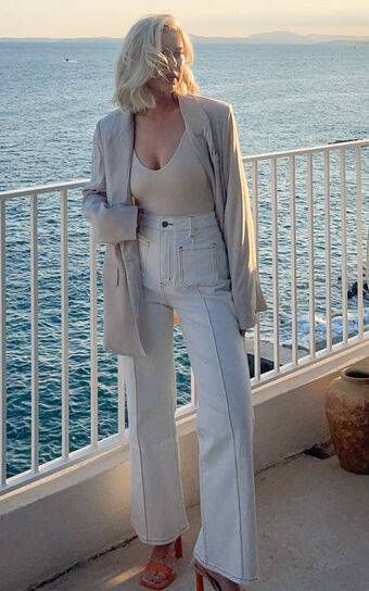 Malcolm Jeans - Mid Rise Contrast Stitch Flared Jeans in White Denim | Showpo (US, UK & Europe)