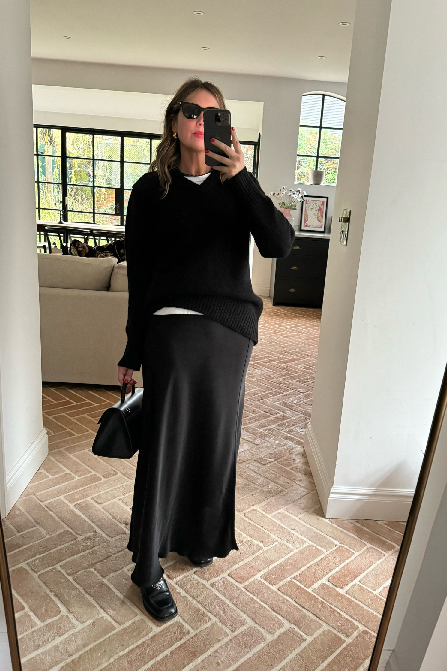 Black Satin Skirt + V Neck Knit + White T-Shirt + Prada Loafers | Monochome outfit | Knitwear | Skirt Outfit 

#LTKeurope #LTKstyletip #LTKwinter