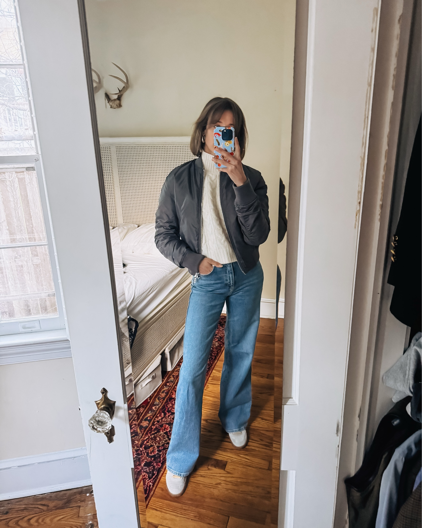 Cool casual weekend uniform: a grey bomber jacket, cream turtleneck sweater, wide jeans and these cool new sneakers.

#LTKOver40 #LTKShoeCrush #LTKSeasonal