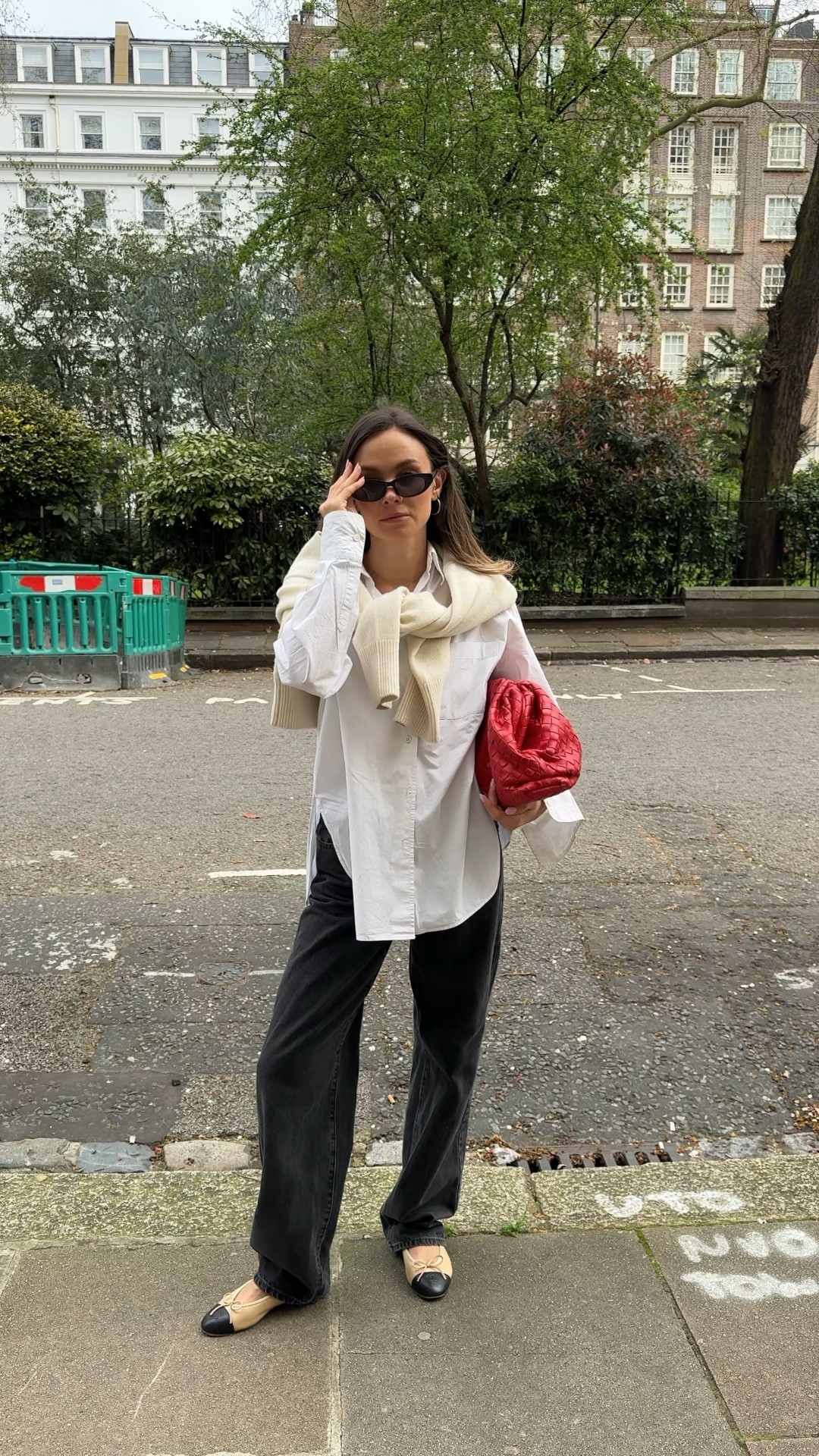 Baggy jeans and pops of red 
Crisp white shirt 
Two tone ballet flats 

#LTKstyletip #LTKfindsunder50 #LTKeurope