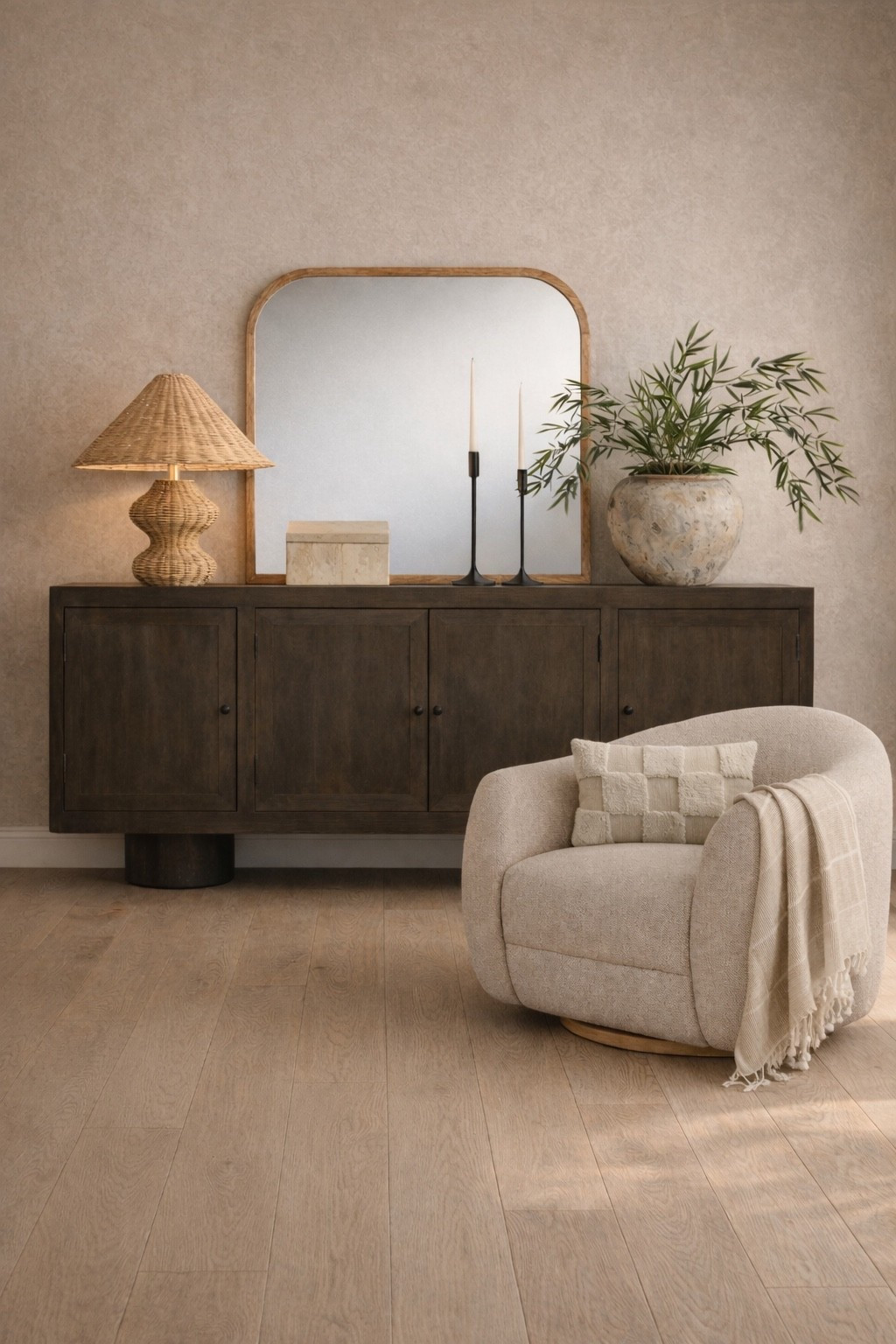 This space looks designer! Would you believe me if I told you it’s all from World Market? I love the rich warm tone of this sideboard paired with the textured elements of this pot and lamp. This swivel barrel chair adds style and comfort! 

#LTKHome