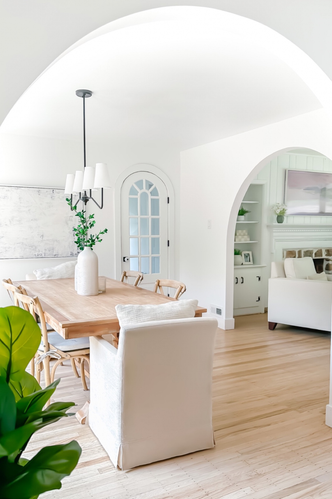 Arched openings are a great way to add character to your home! Living room design, dining room design, organic modern, transitional decor, coastal modern, neutral interiors, Ballard design, wood table, wood dining chairs, linen arm chair, world market, black chandelier 

#LTKFind #LTKunder100 #LTKhome
