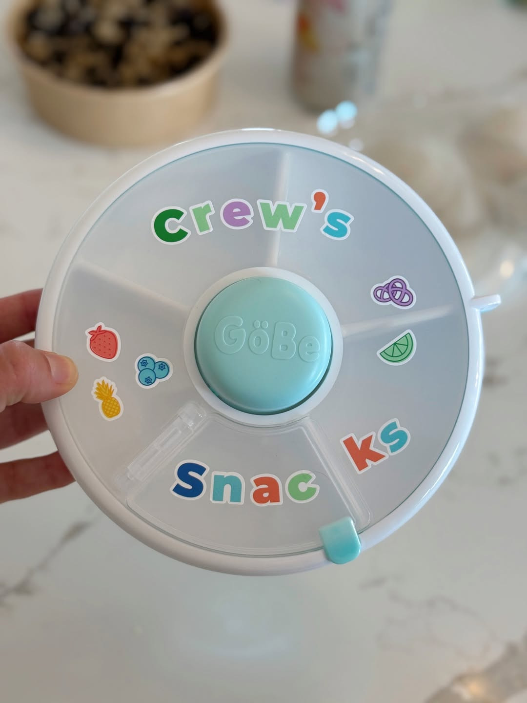Crew's favorite way to snack! You push the button in the middle and it spins the little compartments around! Bonus: it comes with stickers to decorate their own! Slim and lightweight - throw in your bag and go! 

 #LTKHome #LTKBump #LTKFamily
