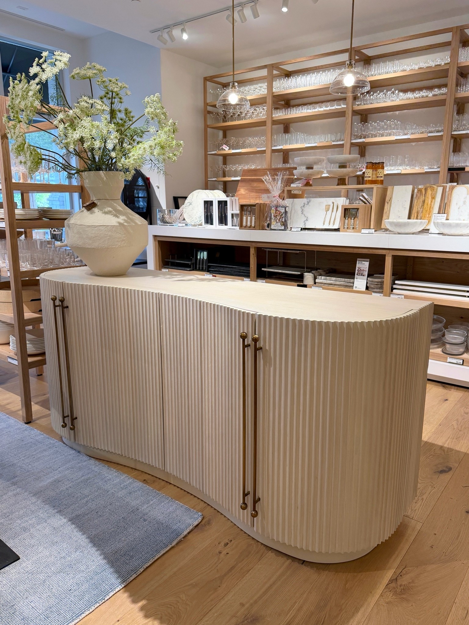Designer credenza moment! 🤩 The Coastline 72” Oak Wood Fluted Credenza by Brigette Romanek for Crate & Barrel is such a stunning statement piece with its sculptural curves and rhythmic fluted detailing inspired by ocean waves. 🫶🏻 The light oak finish paired with burnished brass hardware gives it that perfect blend of luxury and warmth. 💫 A beautiful designer sideboard with ample storage that instantly elevates a dining room or living space. Linked this credenza and more stunning statement storage pieces! ✨ #CrateAndBarrel #LuxuryHomeDecor #Sideboard

#LTKHome #LTKSaleAlert
