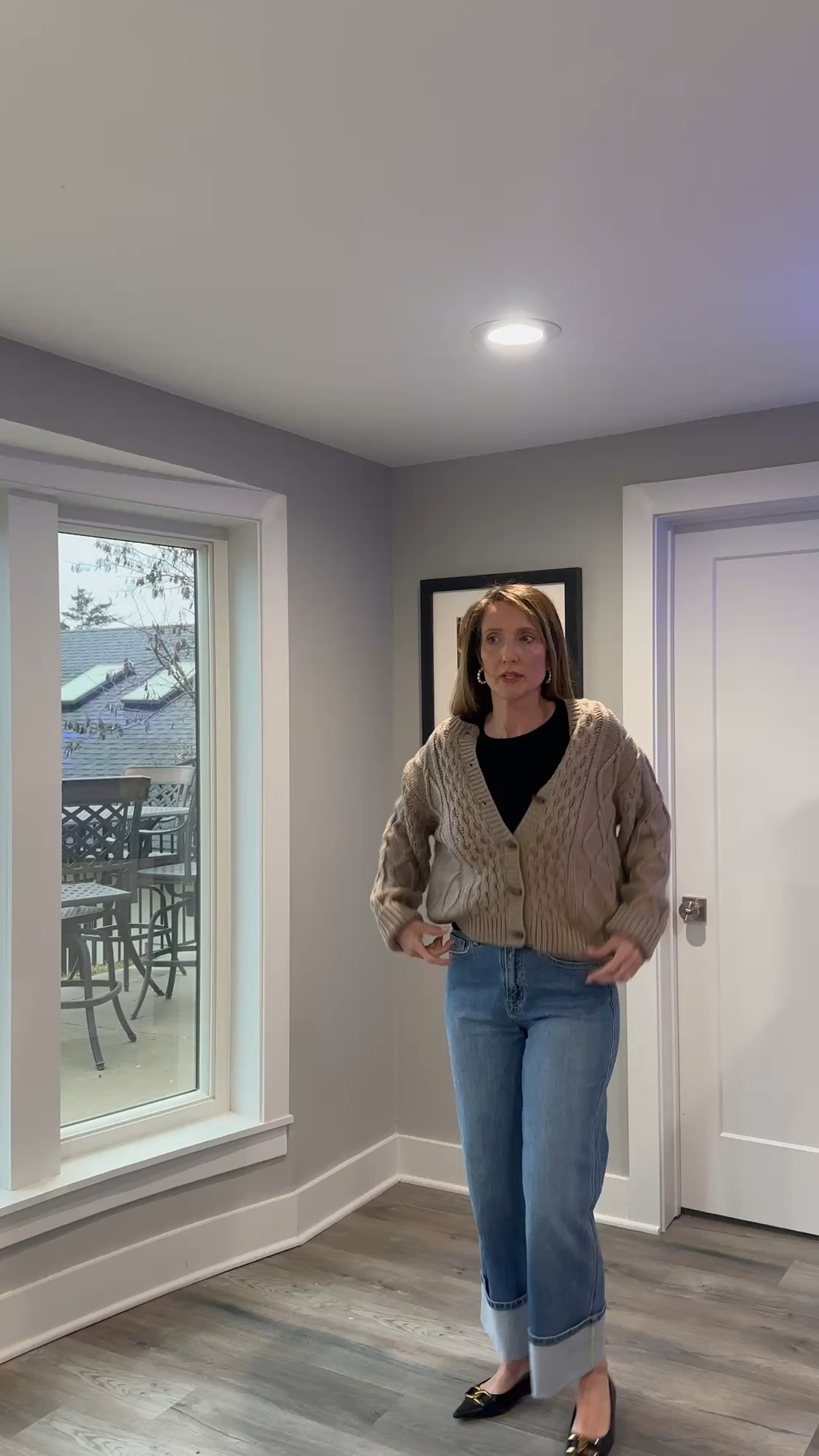 Sometimes the best way to handle a chilly morning is with a classic chunky knit and your favorite denim. ☕️👖 This taupe cable-knit cardigan is such a versatile staple for transitioning into the new season. You can shop this exact layered look and my go-to wide-leg jeans at the link in my bio! #CardiganStyle #CableKnit #SpringLayers #ShopTheLook @VICI 

My Neutral Cardigan Style Breakdown
• The Layer: I’m wearing an oversized, chunky cable-knit cardigan in a warm taupe or mushroom shade, featuring large brown buttons and a deep V-neckline.
• The Base: Underneath, I’ve kept it streamlined with a classic black crewneck tee for a high-contrast neutral look.
• The Denim: I’ve paired the knits with medium-wash, wide-leg jeans that I've styled with an extra-deep cuff at the ankle.
• The Accessories: To add a touch of shine, I’ve included classic gold hoop earrings that complement the warm tones of the sweater.
• The Vibe: This ensemble is the definition of "cozy-chic"—it’s a reliable, comfortable outfit that looks thoughtfully put together thanks to the varied textures.

taupe cable knit cardigan, chunky v neck sweater, mushroom oversized knit, black crewneck tee, wide leg cuffed jeans, medium wash denim, gold hoop earrings, spring layering outfit, casual neutral style, effortless weekend look, LTKstyle

#LTKOver40 #LTKmomlife #LTKootd