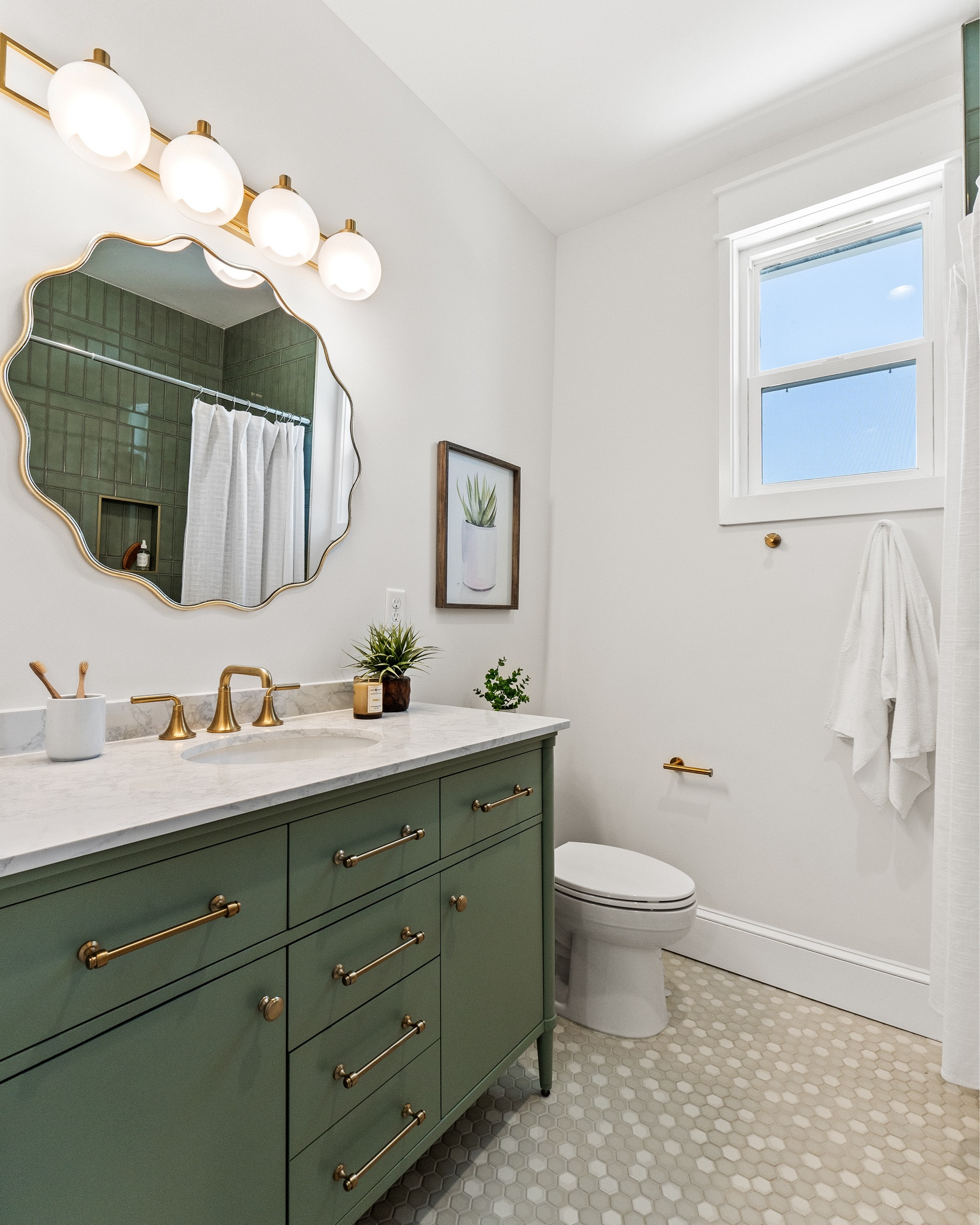 Feeling fancy in this gold & green bathroom!

#hexfloortiles #greenbathroomtile #greenvanity

#LTKHome