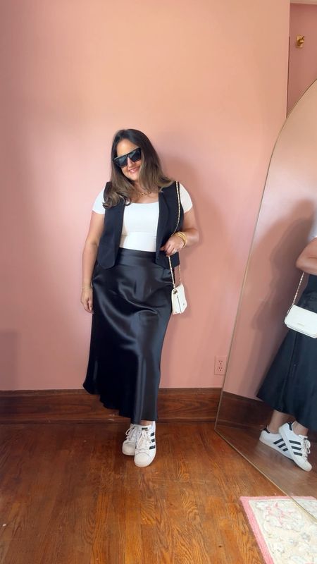 A casual workwear outfit in this black satin midi skirt, white tshirt, and black vest! Wearing a size xl in everything.

Midsize
Curvy
Workwear
Work outfit
Pinterest outfit
Vest outfit
Midi skirt
Amazon fashion
Adidas
Cute sneakers
White tshirt 

#LTKWorkwear #LTKVideo #LTKMidsize