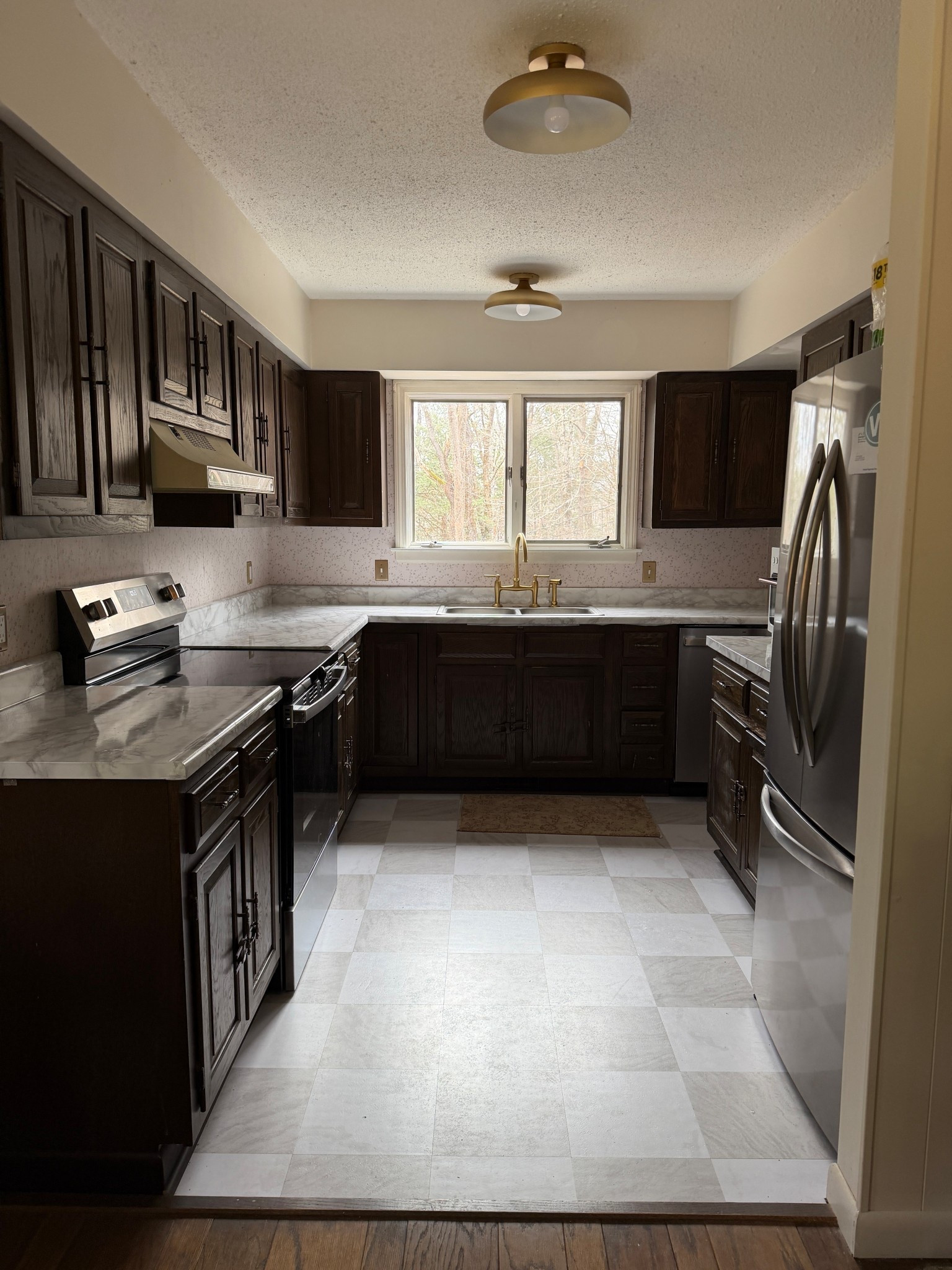 To hold us over until we can do a full kitchen renovation we have done peel and stick tile, peel and stick countertops, peel and stick wallpaper, and today I'm adding a peel and stick backsplash. The floor tiles are great - but I'll be honest the countertops were hard and I don't recommend! I'll tag it here anyway if you dare! 

#LTKHome