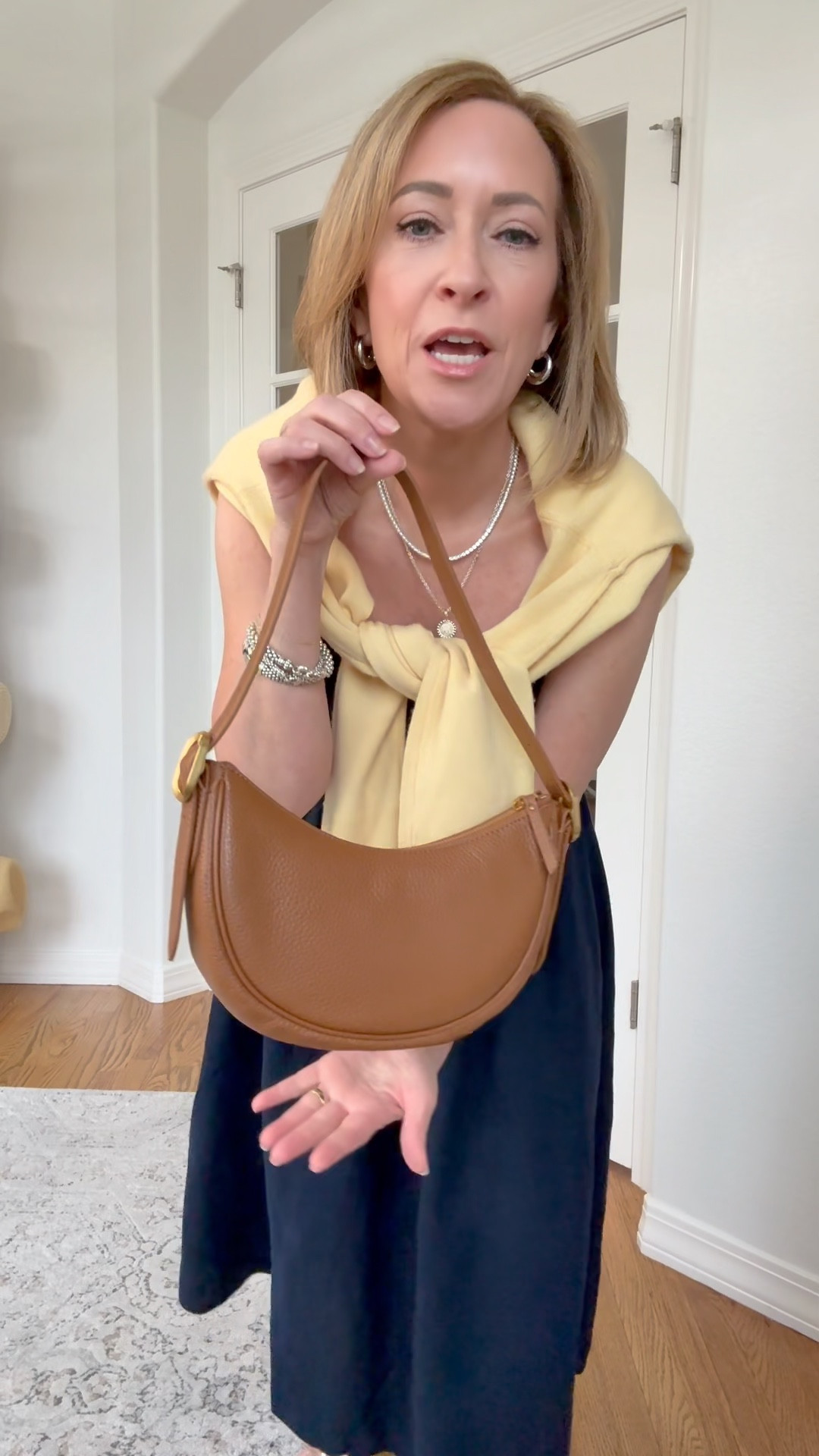 The mini crescent bag is the perfect size. I love the cognac colors, it’s also available in black. 

#ad #sponsored @onequince #quincepartner 

#LTKPetite #LTKOver40 #LTKStyleTip