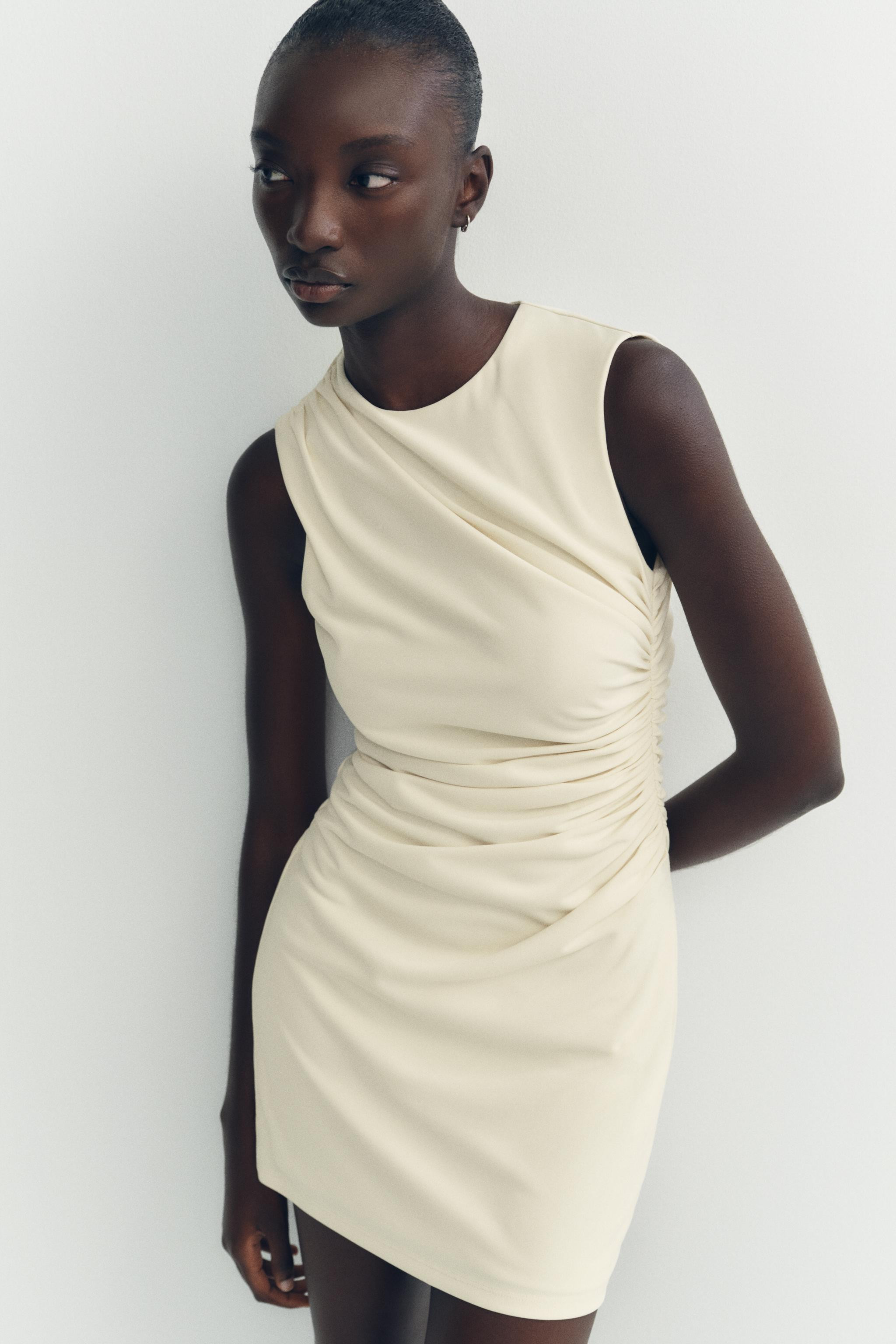 Sleeveless mini dress with round neckline. Ruched fabric. Invisible back zip closure. | Zara US