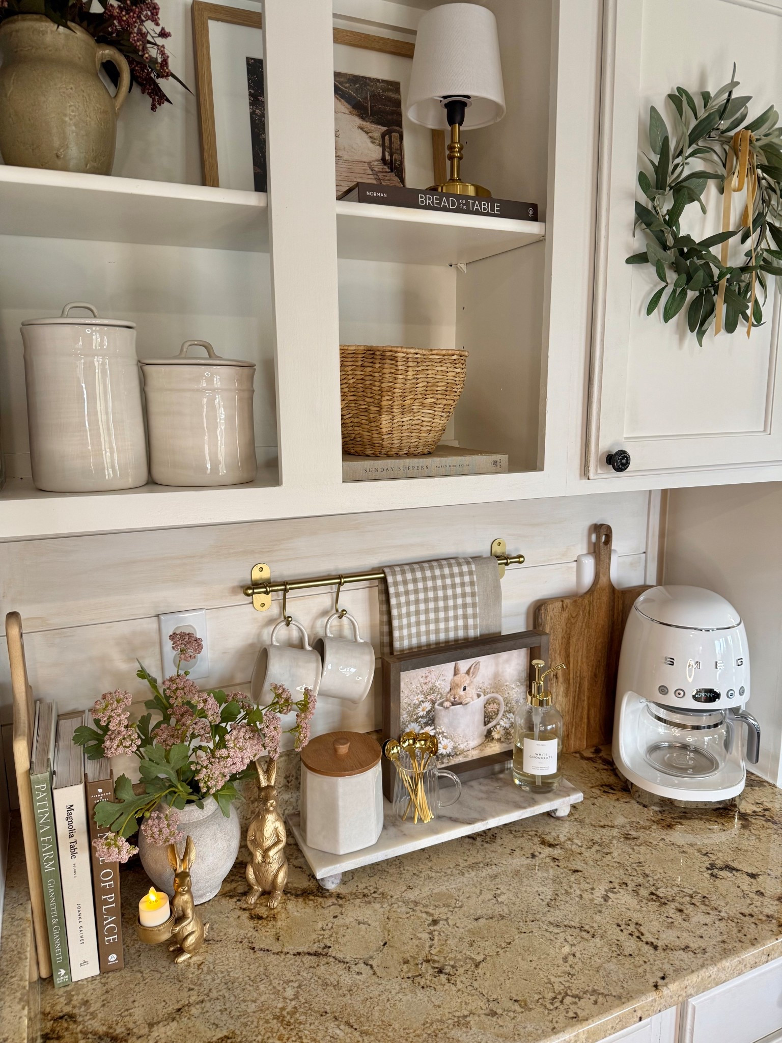 Spring | Easter Coffee Bar 

Follow @farmtotablecreations on Instagram for more home styling ideas and daily deals.

Follow along as I style the cutest piece of spring artwork from my sweet friend Brittany @currentlychic. The Bunny’s Morning Brew is shown here in the 9x12 size with the Briarsmoke stained frame, and it adds the most charming seasonal touch to this little coffee bar moment.

I paired it with neutral mugs (that perfectly match the one in the artwork), softly layered tea towels, a set of gold spoons for a warm, collected feel, and a bottle of syrup to make those morning cups feel a little extra special. It’s such a simple way to bring a little Easter charm into the kitchen while keeping everything light, cozy, and neutral enough to enjoy all season long.

Use code FARMTOTABLE to save 15% off artwork.
Four stems in vase.

#coffeebar #springdecor #easterdecor #springrefresh #springcoffeebar #kitchen #counterdecor #springcoffeebar #eastercoffeebar




#LTKSaleAlert #LTKHome #LTKSeasonal