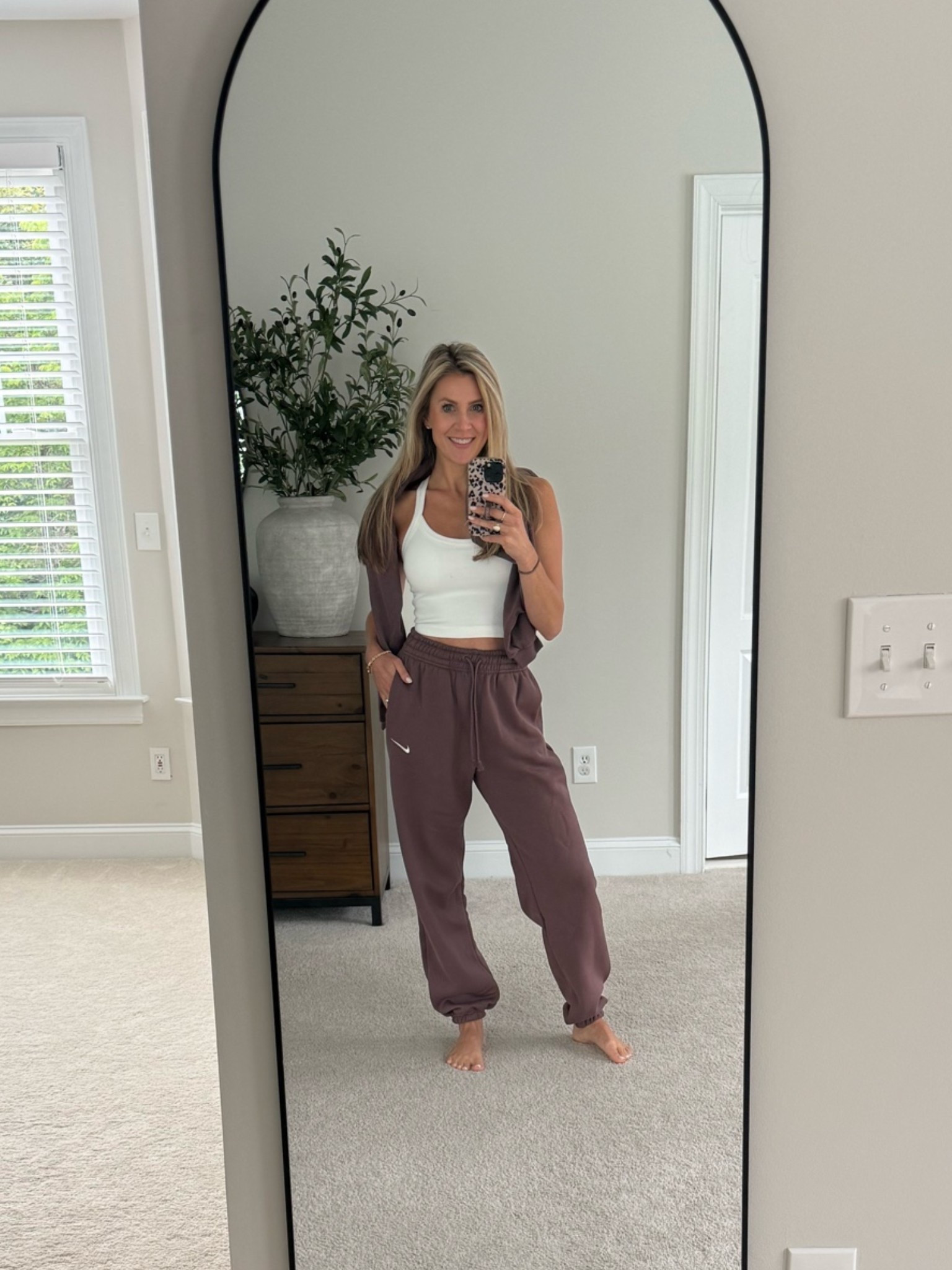 Loving this Nike sweat set.  Cropped sweatshirt, soft sweats, and LOVE the color as a transition into fall 😍

#LTKgrwm #LTKmomlife #LTKActive