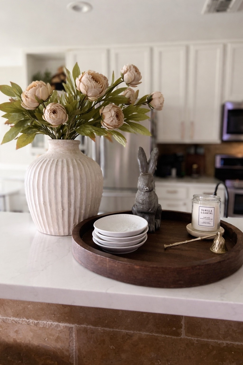 Spring kitchen vignette 
Spring kitchen styling 
Easter kitchen decor 
Pottery Barn Essex bunny 
Wood tray 
Viral peonies 

#LTKHome #LTKSaleAlert #LTKSeasonal