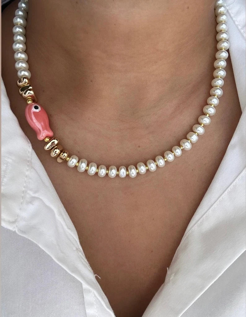Glass pearl beaded necklace with fish bead and gold accent beads | Etsy (US)