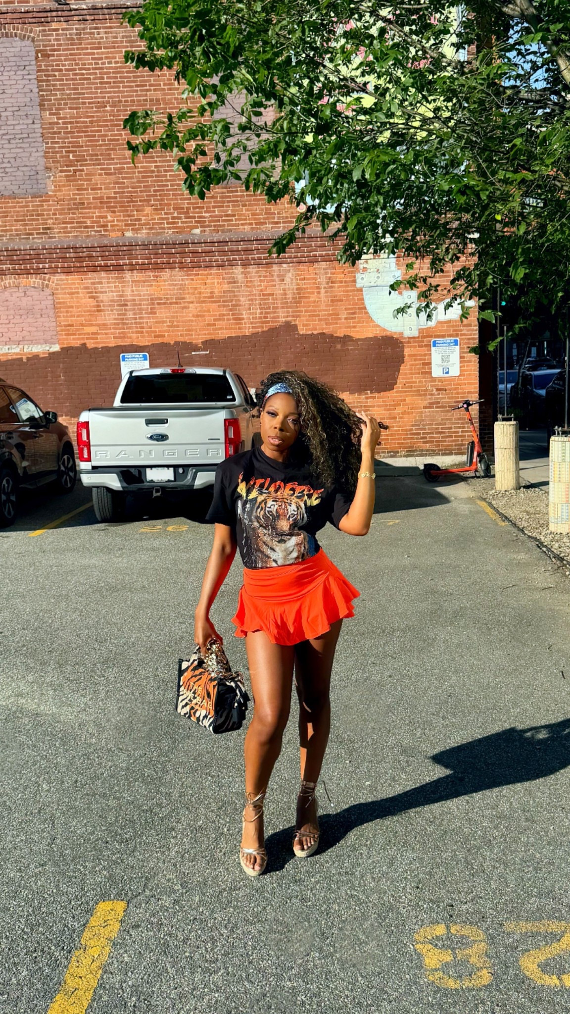 I wore this outfit to a day party, and it was the perfect look for a summer day 🌇✨. Got this whole outfit (minus the bag) from SHEIN!

I’m wearing the orange skort in a size 4 (true to size), and the tiger graphic T-shirt in a size 4 (it does have a oversized fit, so I used a hair tie to take in the back). It looked so cute with my tiger print Marc Jacobs bag 🐅.

These strappy wedge sandals are really comfortable, and true to size  (I’m wearing a size 10). They were great for dancing and being comfortable standing around. Definitely recommend these for your summer outfits or vacation outfits!

#LTKFindsUnder50 #LTKSeasonal