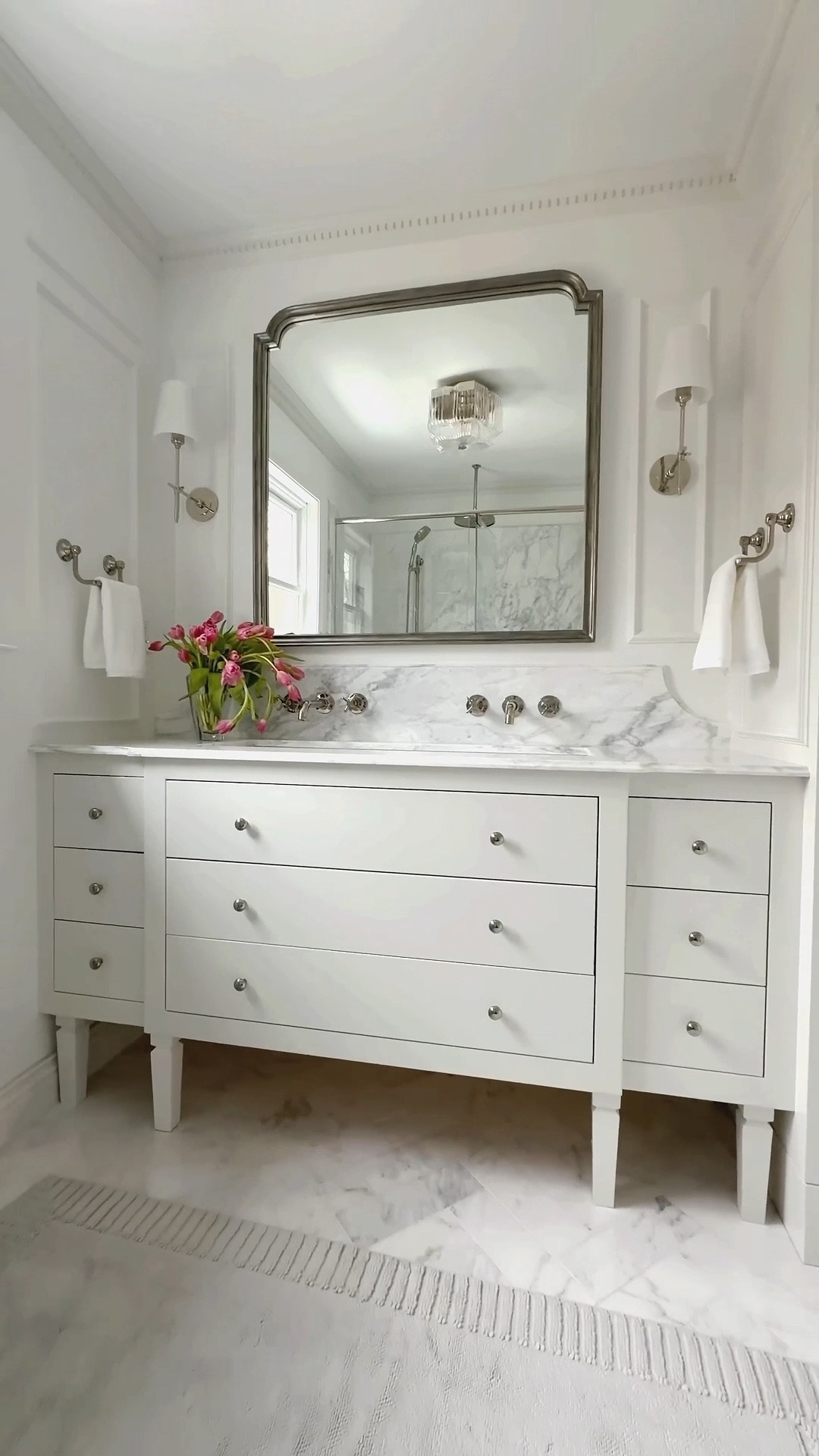 Modern marble bathroom sources 🤍
Shop this full ’90s bathroom remodel—featuring marble tile, marble countertop, polished nickel fixtures, white milk glass wall sconces, framed mirror, and custom style vanity. Timeless, high-end look in a small space.

#LTKHome #LTKmorningroutine