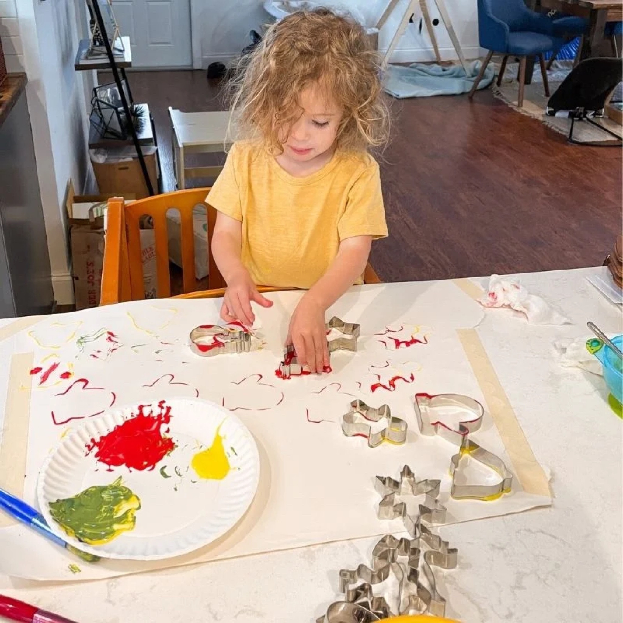 Christmas Sensory Art: Cookie Cutter Stamping! Get some extra use out of those Christmas cookie cutters by using them as stamps in this easy Christmas arts + crafts activity for toddlers and preschoolers!

#LTKkids #LTKSeasonal #LTKHoliday