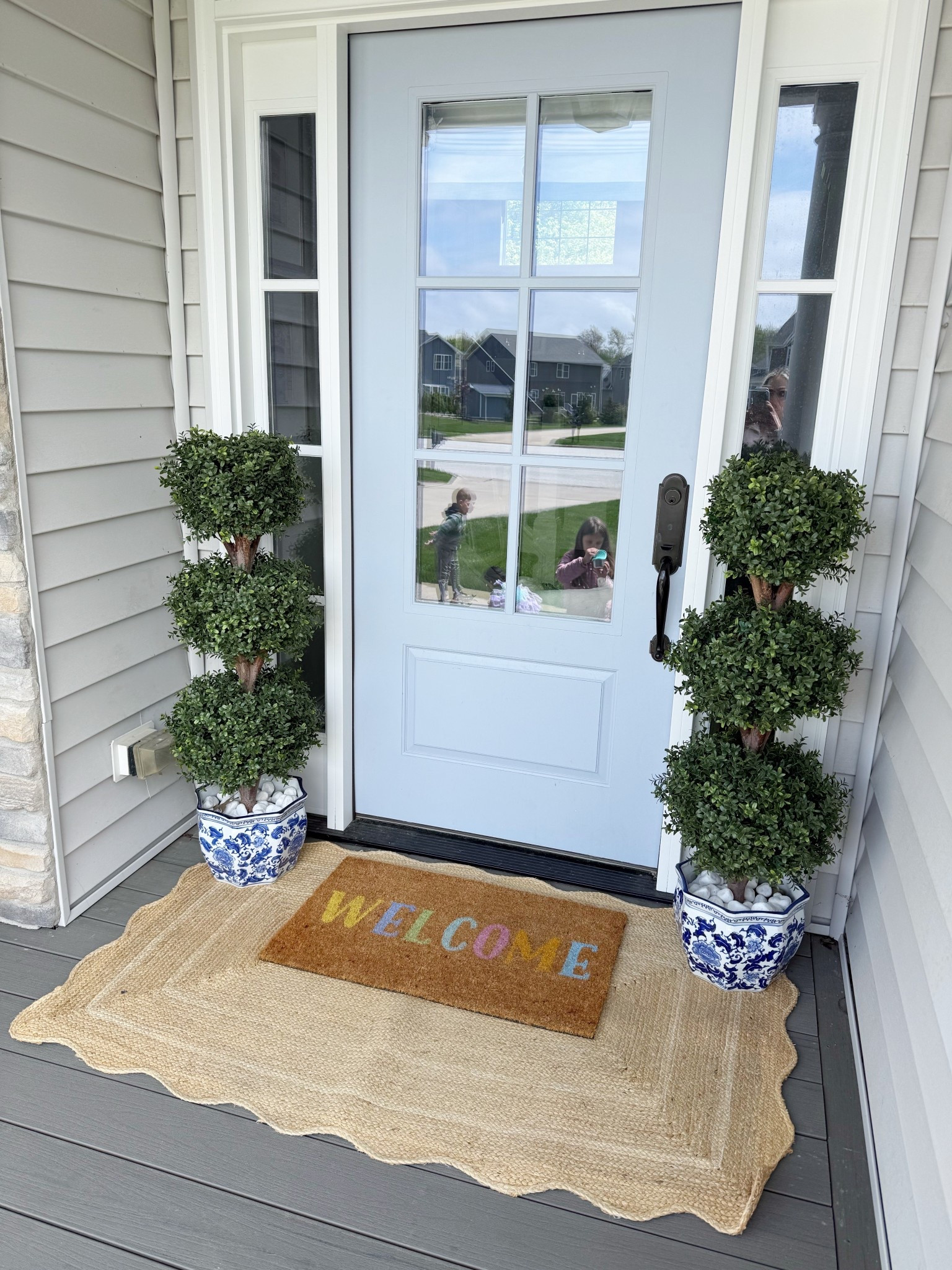 Traditional grand millennial front porch with faux, topiaries and doormat 

#LTKHome #LTKmomlife #LTKSaleAlert