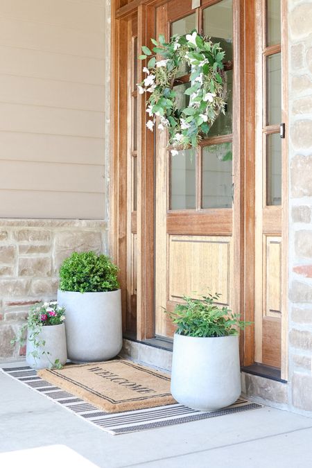 Bring is coming. Get your planters and spring wreaths early. Welcome mat, pottery barn, spring wreath, patio, front door 

#LTKSeasonal #LTKhome #LTKSpringSale