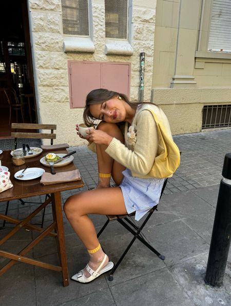 Sezane, Free people, Anthropologie, Saint paradiso, Princess polly, Asos, transitional outfit, transitional style, spring outfit, spring fashion, yellow cardigan, yellow shoulder bag, striped shorts, boxer style shorts, slingback flats, Ganni dupe, spring outfit ideas, style inspiration 

#LTKstyletip #LTKSeasonal #LTKeurope