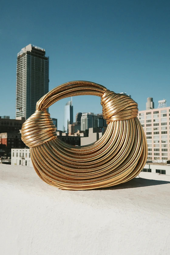 Deeply Luxe Gold Metallic Knotted Cord Crescent Handbag
            Lulus
         $78
        Pr... | Lulus