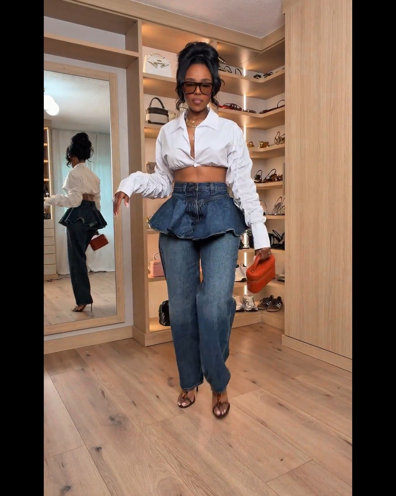 Hi Babes! 

Okay this denim peplum moment is EVERYTHING 💙 The structured waist detail gives such a snatched silhouette while still keeping the oversized denim fit trendy and effortless. Paired with the cropped white button down and orange bag? Chef’s kiss.

The jeans fit relaxed through the leg without looking bulky, and the peplum detail adds shape in the prettiest way. Definitely one of those outfits that looks designer-inspired and fashion forward.

Perfect for:
• Fashion brunch dates  
• Girls night or rooftop dinners  
• Vacation city looks  
• Content days when you want a statement outfit  

Undergarments: seamless nude thong + sticky bra or boob tape under the cropped blouse.

Everything is linked below ✨

xx Kira | IG: KirasFashionFinds

34D - 27 - 40 • Size Small or 4