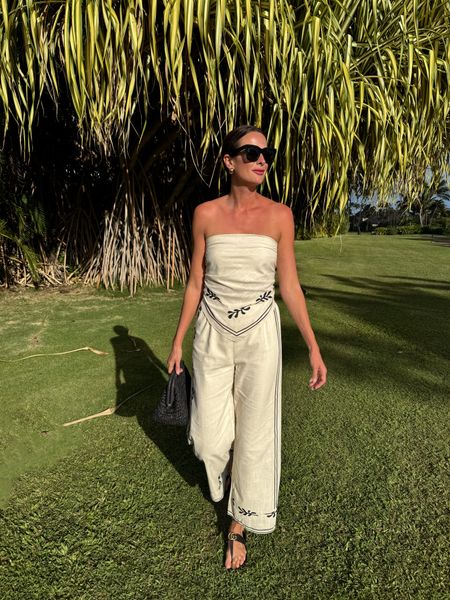 This linen set is a total vibe! I wore it with nippies and tied the back tight so I wouldn’t have to mess with it! Stayed up no problem! The pants have an elastic waistband and fit true to size! I’m wearing a small. 

#LTKSeasonal #LTKSpringSale #LTKtravel