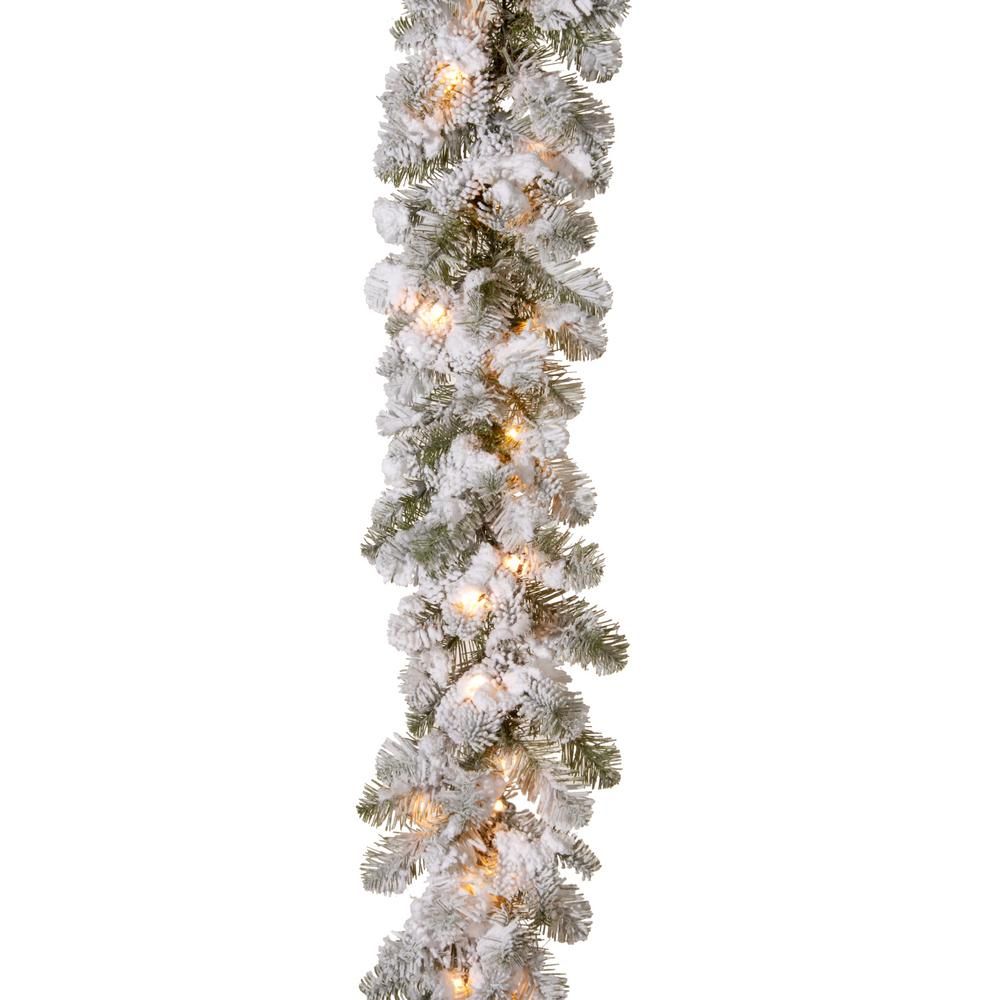 9 ft. x 12 in. Feel Real Snowy Camden Garland with 50 Clear Lights | The Home Depot