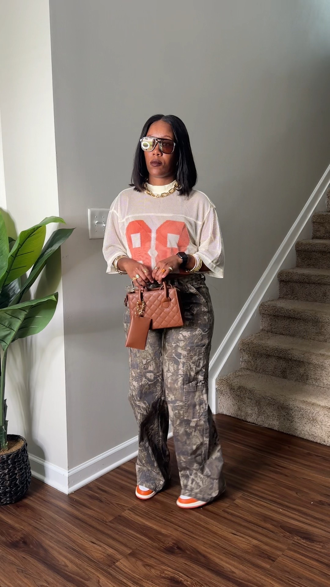 Jersey shirt and camo cargo pants outfit idea. I accessorize this casual outfit with gold jewelry, brown purse, and brown sunglasses 

#LTKPetite #LTKFindsUnder50 #LTKStyleTip