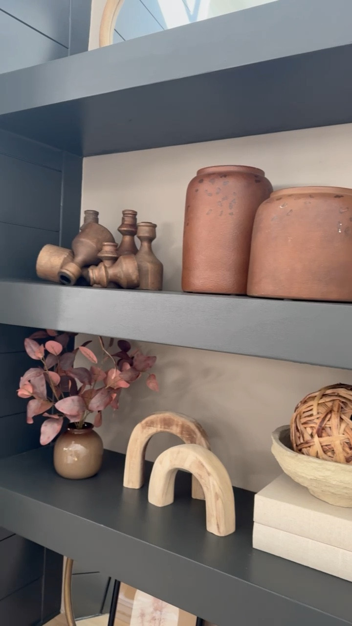 Fall decor on the built ins🤎🍂🙌🏽🎃 gimme all the cozy, warm & neutrals! Linked everything I could! A few finishing touches still to come but — love sharing! 

Things not linked 👇🏼
*top left mirror is old from Kirklands, top rustic vase is Home Goods, top right print is Kirklands!*

*middle shelf burnt orange vases are old from Target, basket weave ball is old from Kirklands*

Home / fall decorating / neutrals / cozy home / target / amazon / inspo / home design / style / autumn / shelf inspo / Holley Gabrielle / fall home / modern / vintage 

#LTKHome #LTKSeasonal #LTKVideo